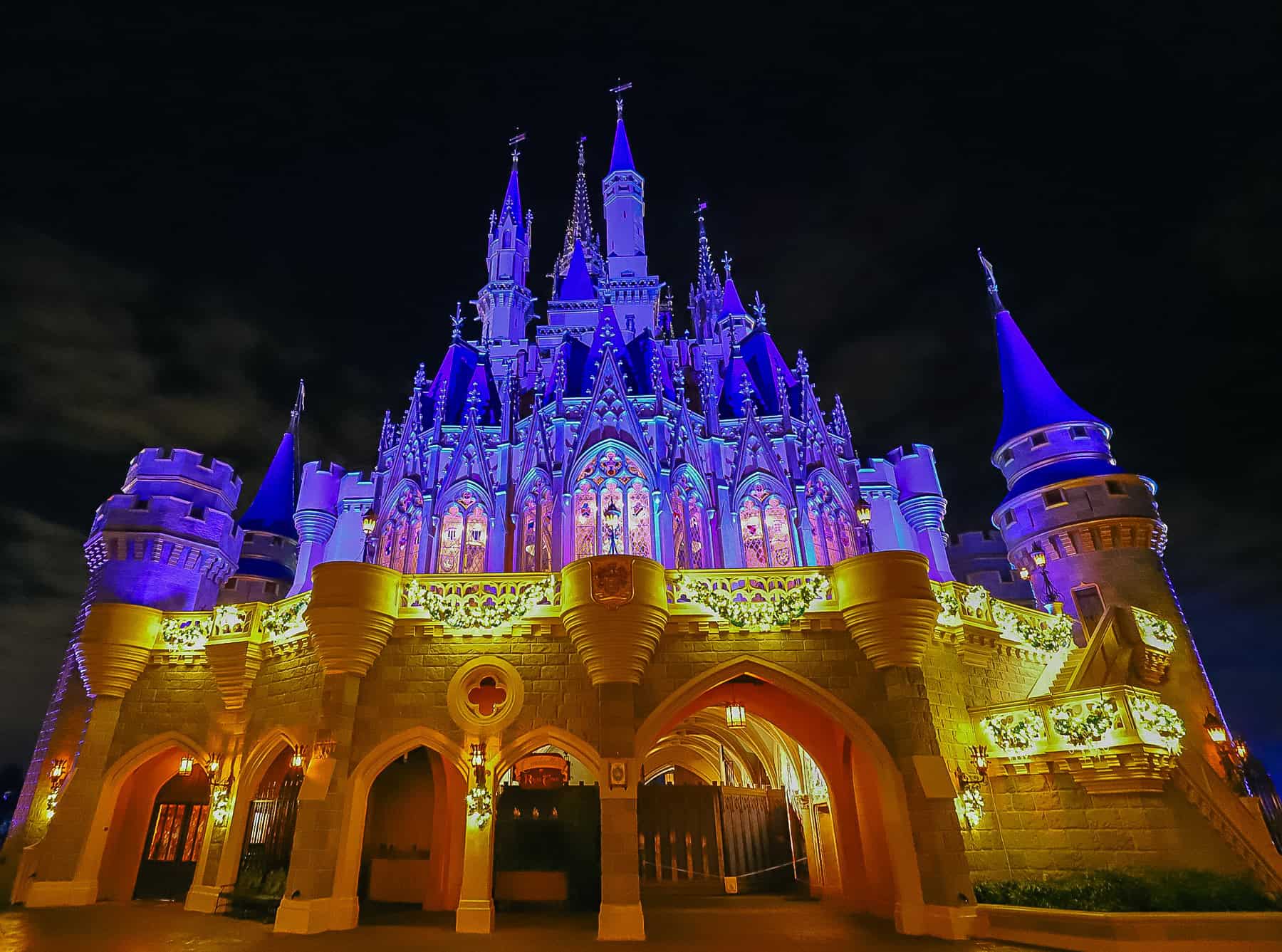 the back side of Magic Kingdom's castle in the evening