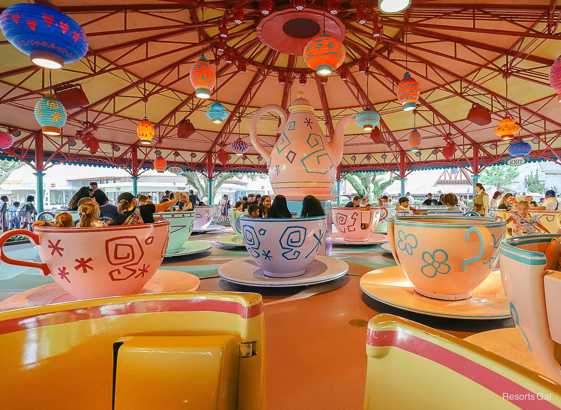 guests riding the Mad Tea Party attraction in Magic Kingdom 