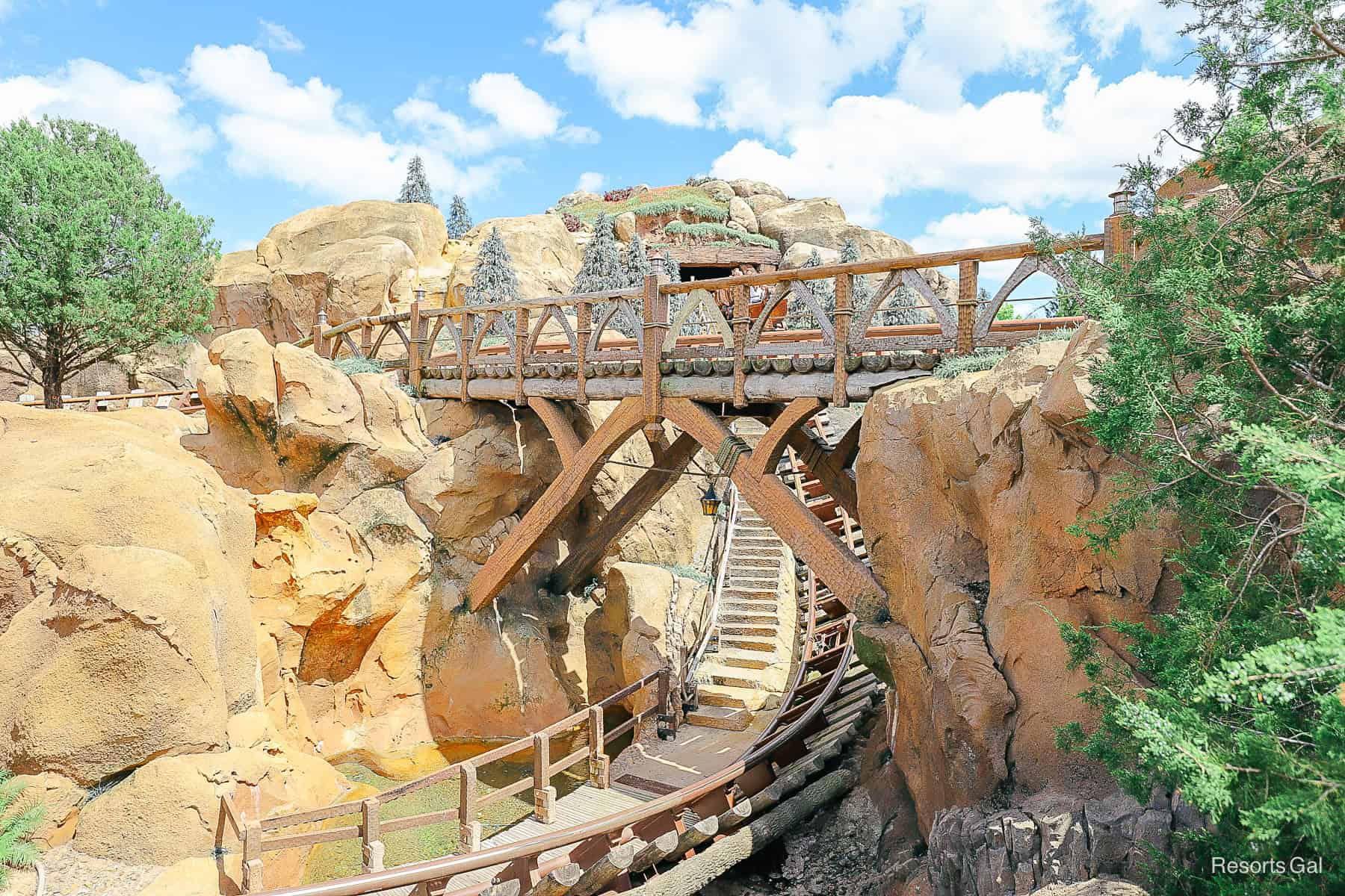 Guests riding Seven Dwarfs Mine Train at Magic Kingdom. 