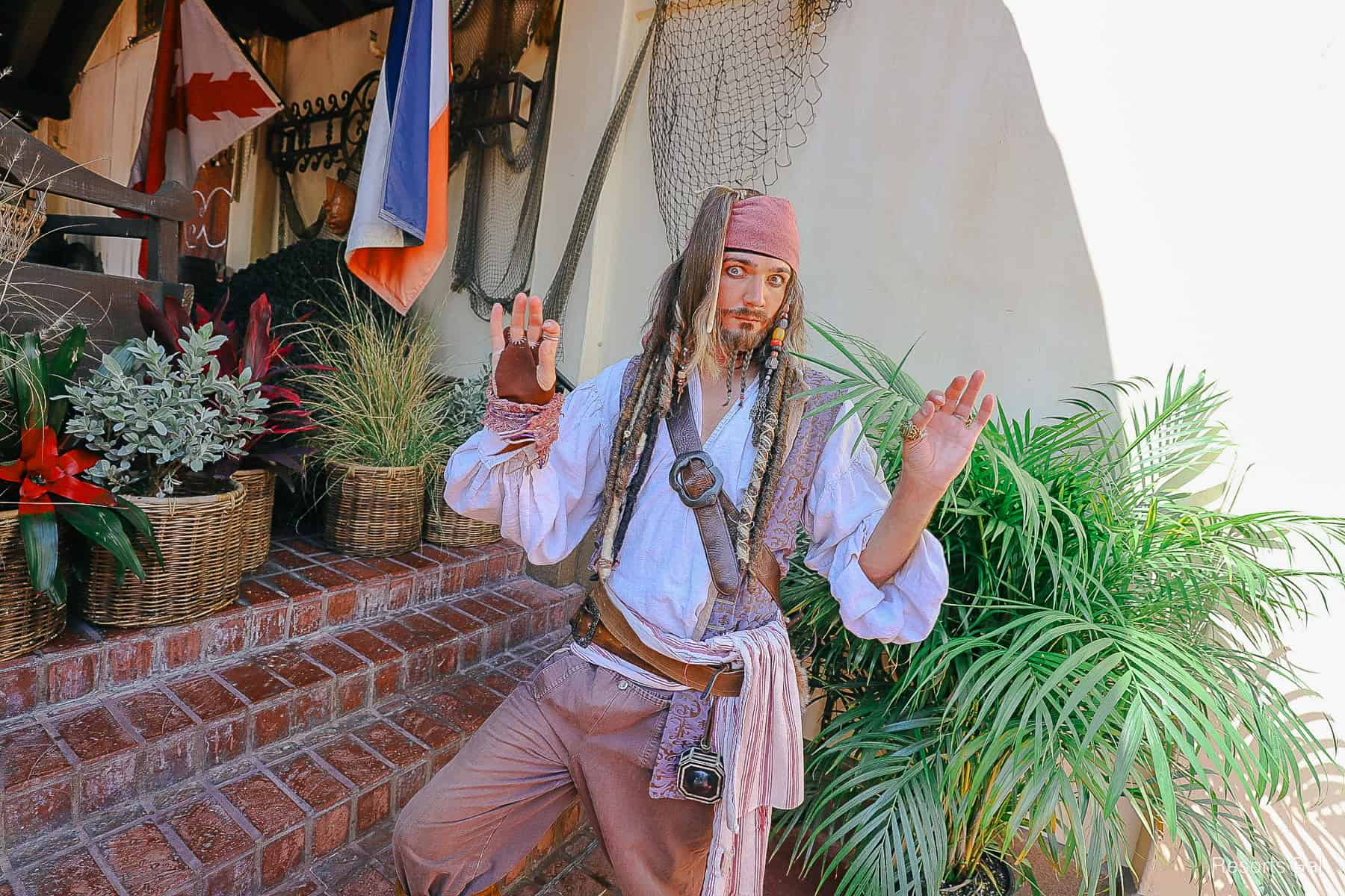 Captain Jack Sparrow poses for a photo in Adventureland. 