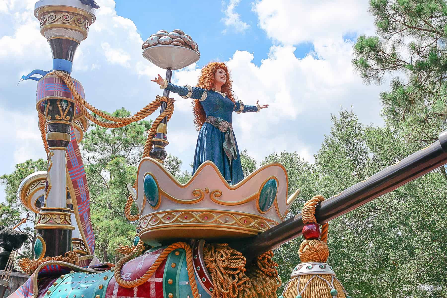 parade photo with Merida's arms extended 