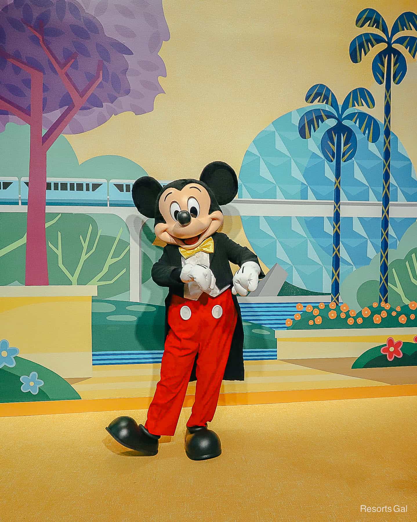Mickey wears a suit and tie at this meet-and-greet 
