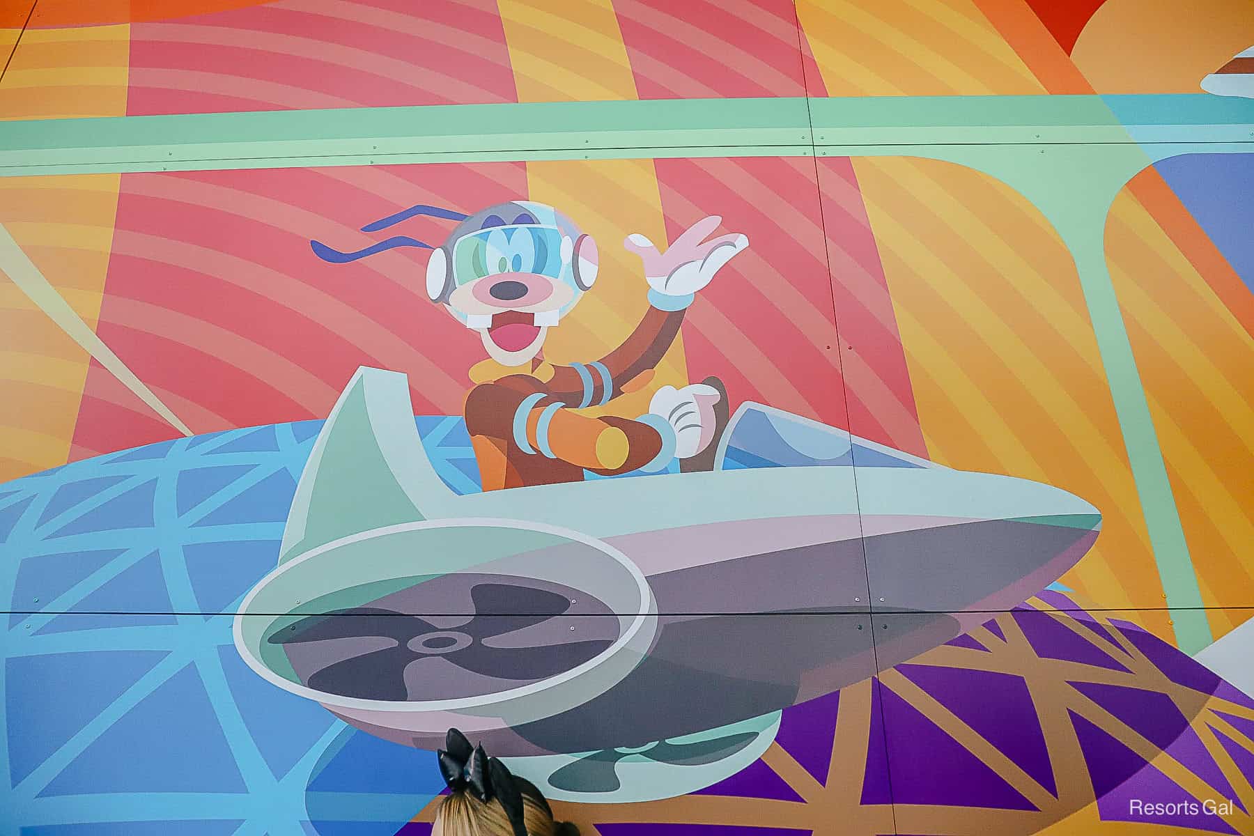 Goofy in a spaceship mural with reference to Spaceship Earth 