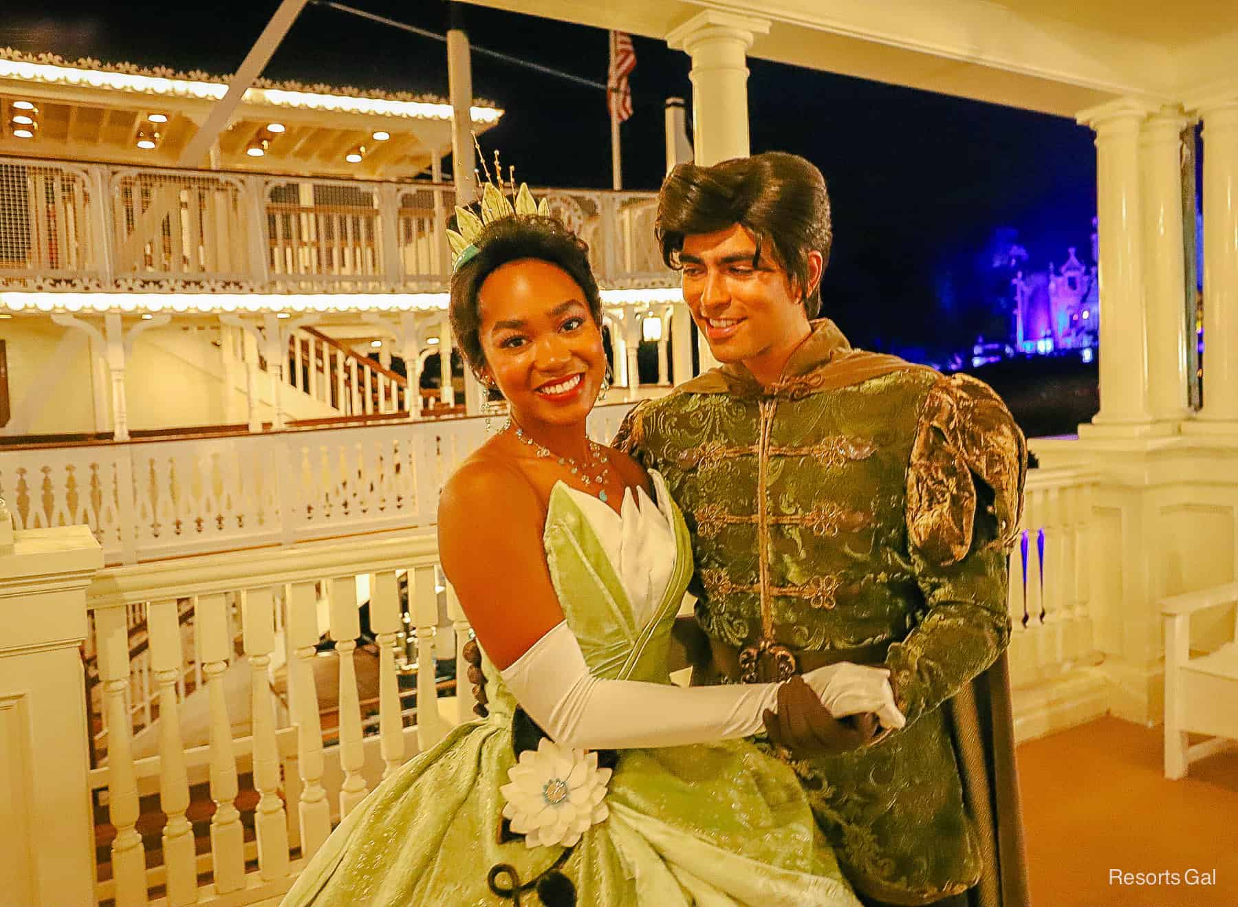 Princess Tiana and Prince Naveen in front of the Liberty Square Riverboat at Magic Kingdom 