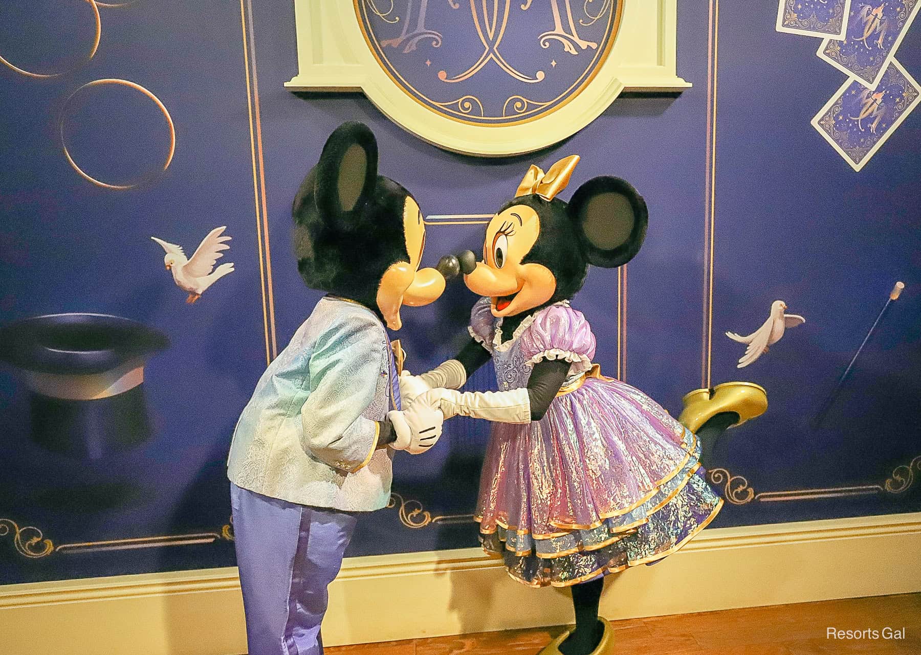 Minnie and Mickey lean in for a nose kiss. 