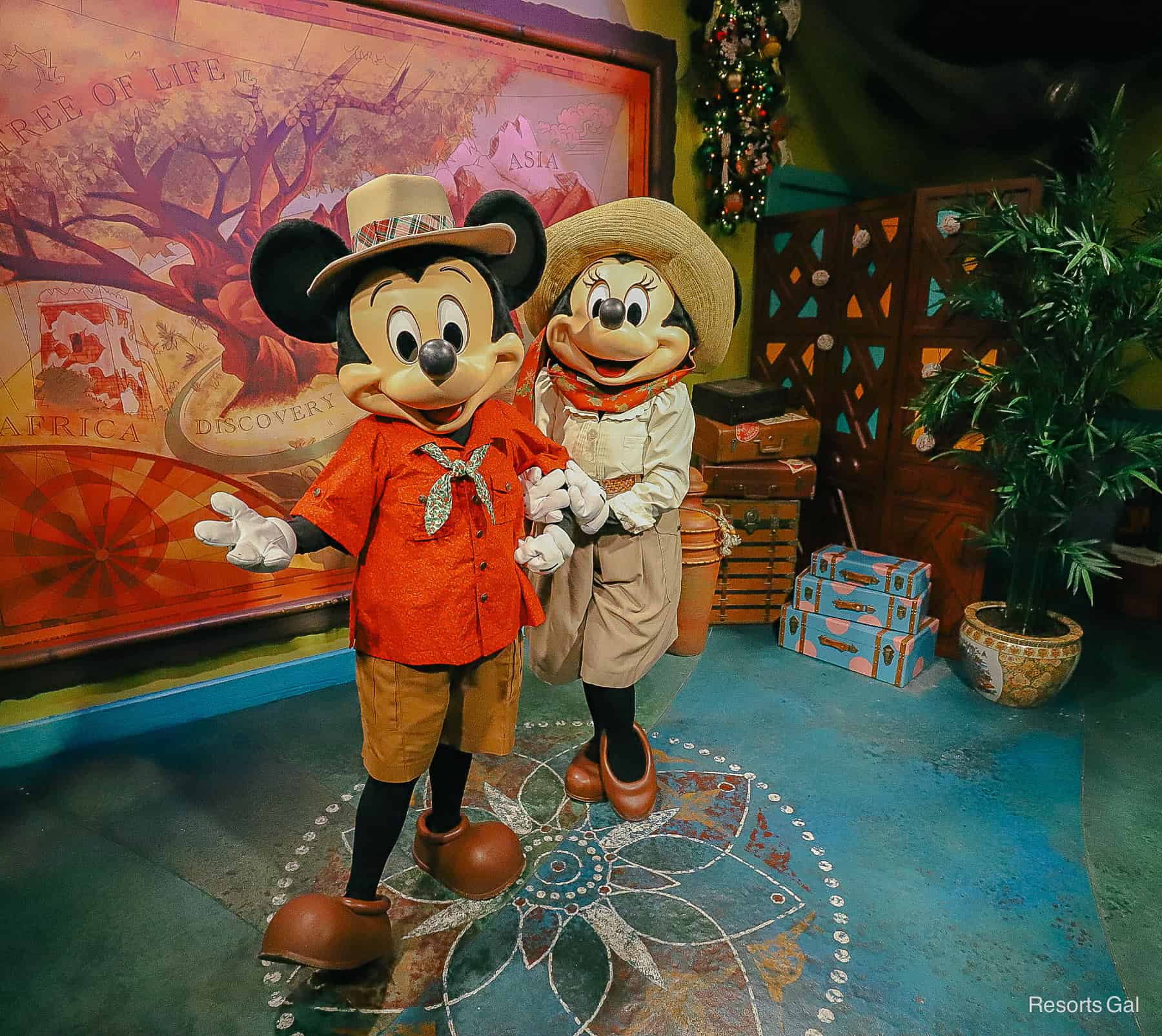 Mickey and Minnie Mouse in holiday outfits at Adventurer's Outpost 