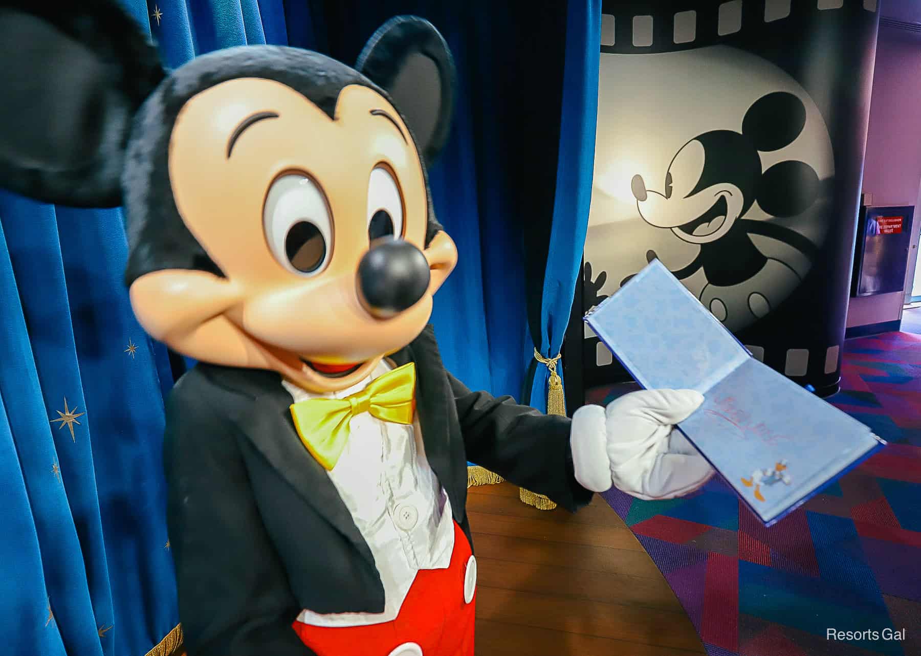 Mickey shows where he signed his character autograph. 