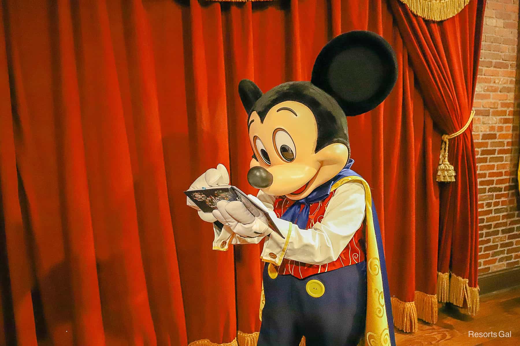 Mickey signs his autograph. 