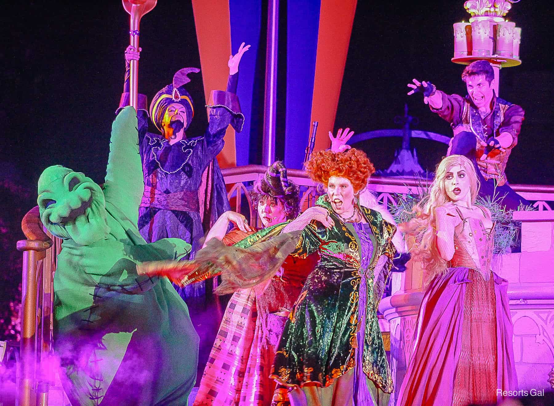 Oogie Boogie and the Sanderson Sisters performing on stage during the Villains Spelltacular at Mickey's Not So Scary Halloween Party 