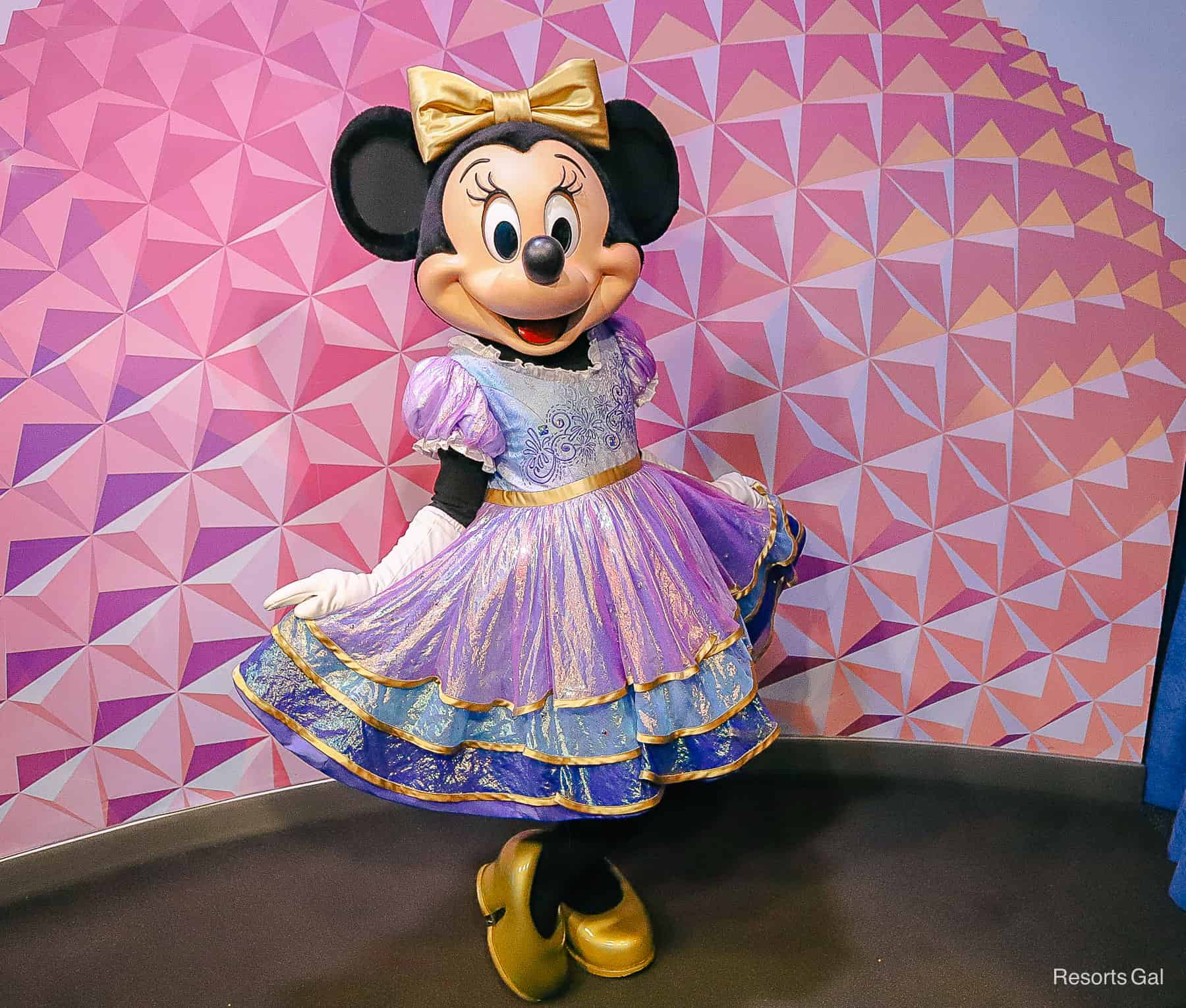 Minnie Mouse poses to show off her special anniversary dress. 