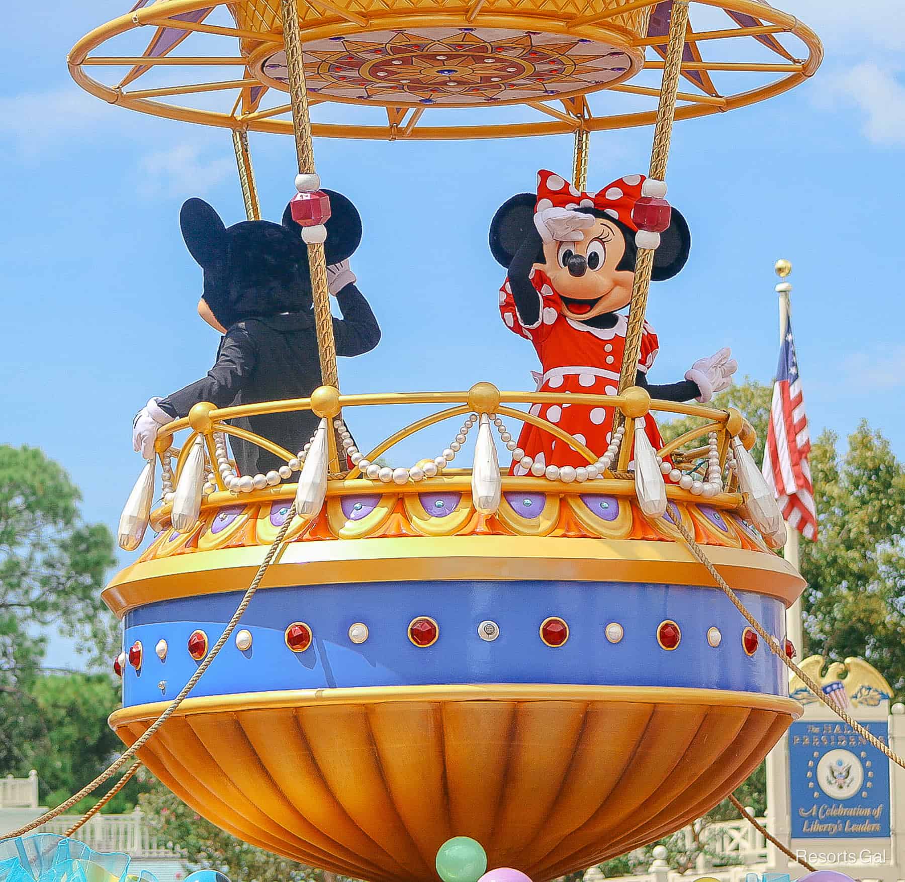 Minnie looks out to guests from Mickey's Airship in the parade. 