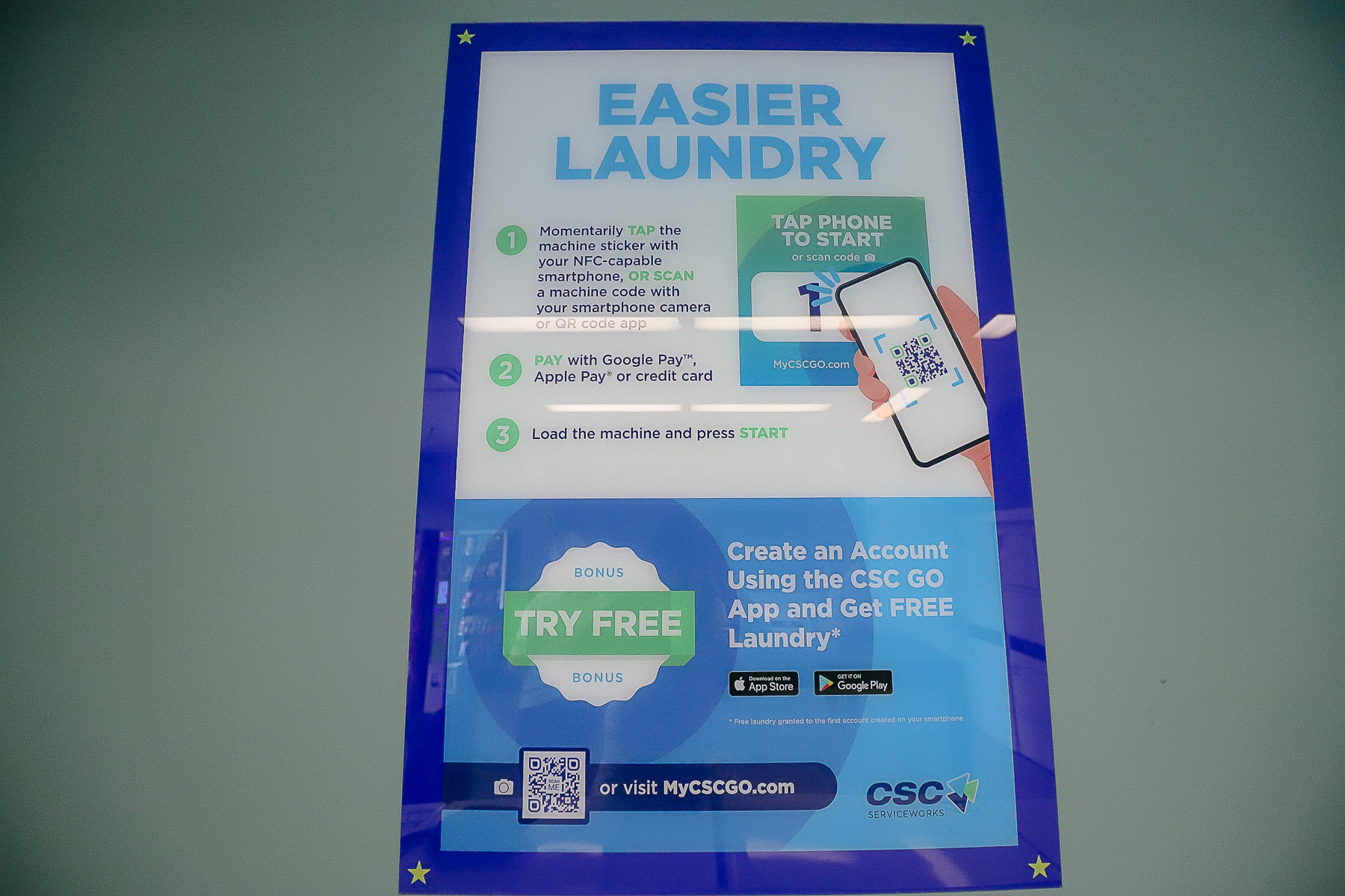 a sign that shares the details of the My CSCGO.com laundry app service 