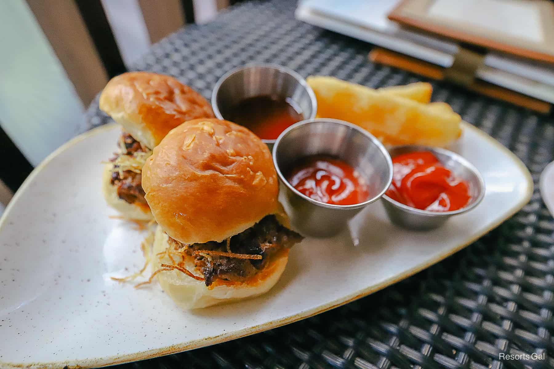 two pork sliders with ketchup and Yucca fries 