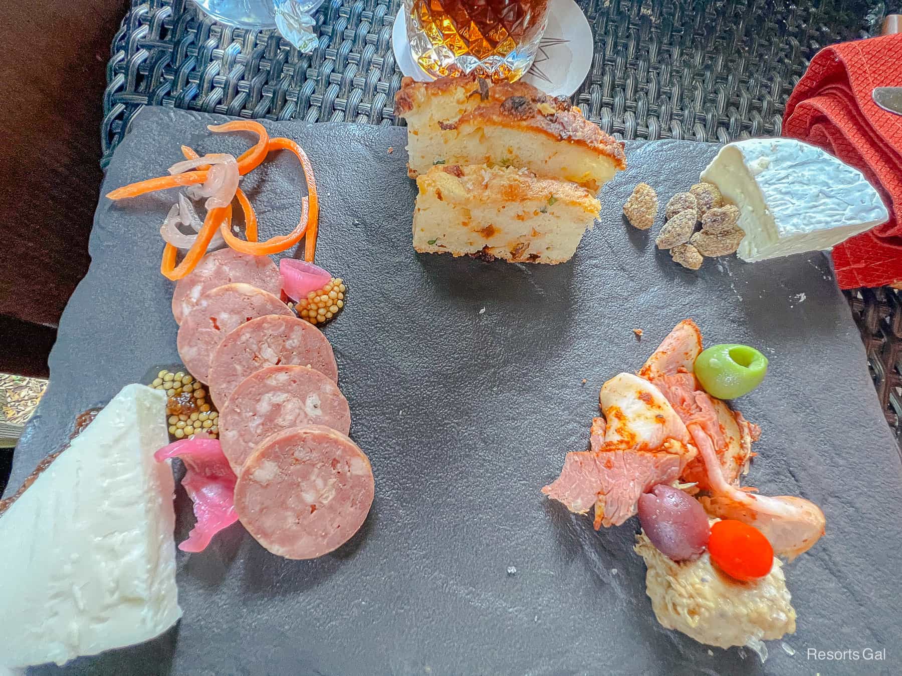a charcuterie platter with various meats and cheeses 