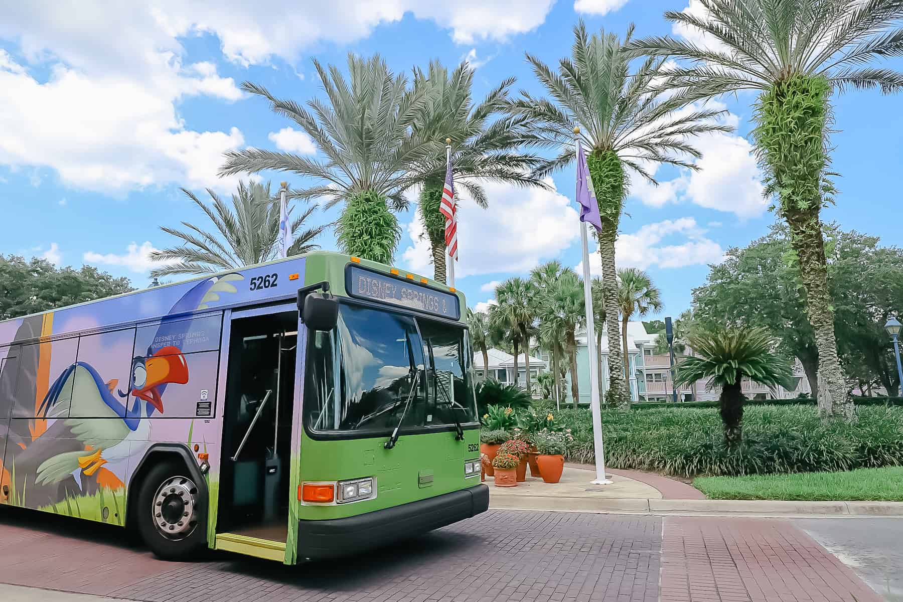 a bus with palm trees in the background at Disney's Old Key West 