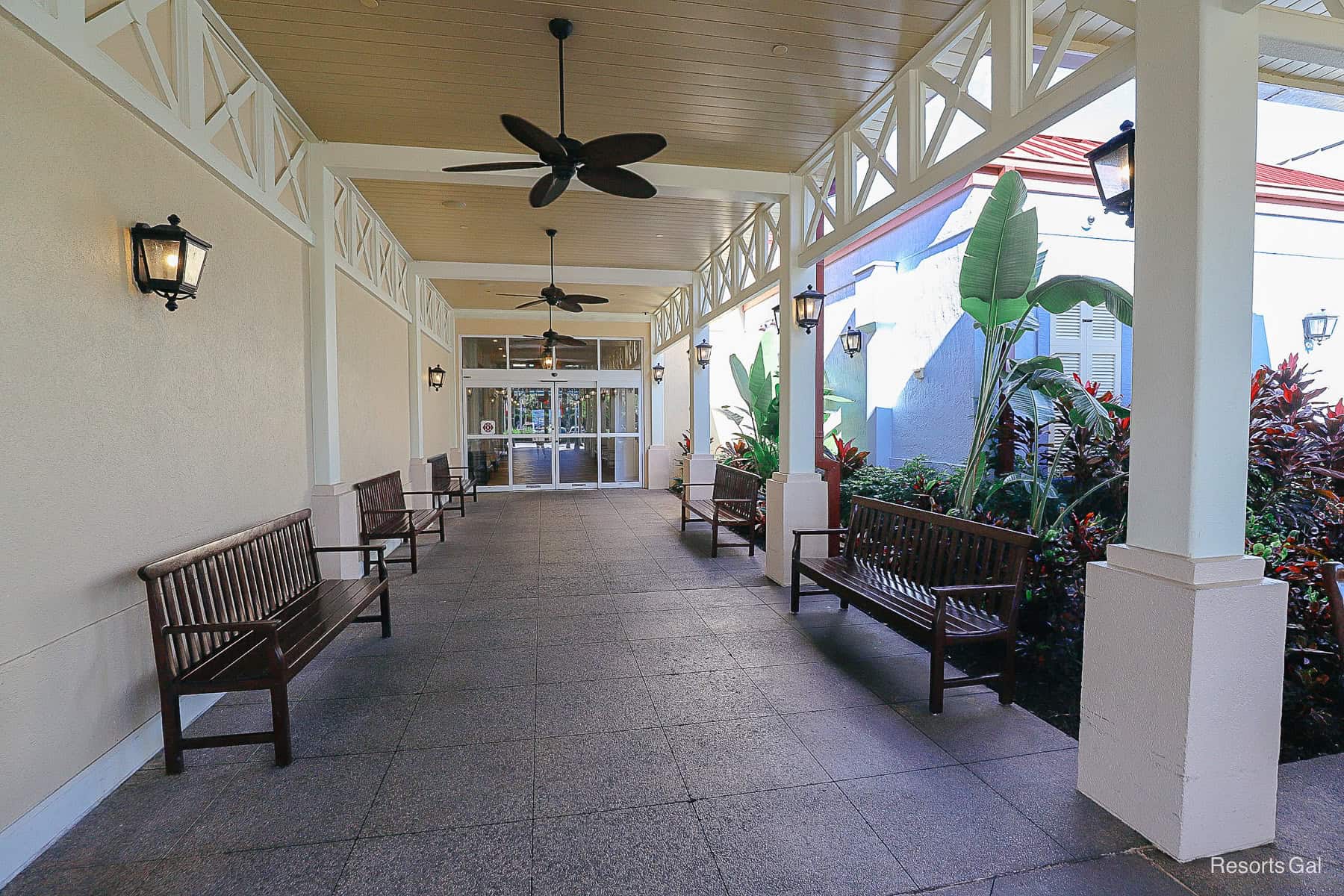 a covered seating area leading up to the front entrance of Old Port Royale 