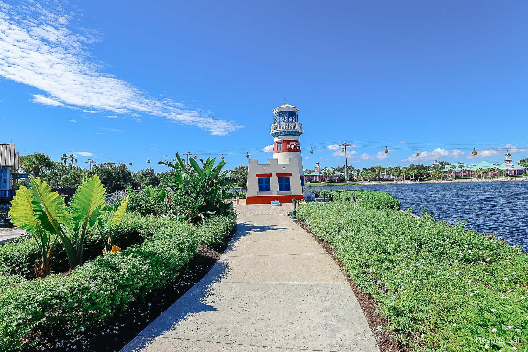 a small path that leads to the lighthouse on Barefoot Bay 