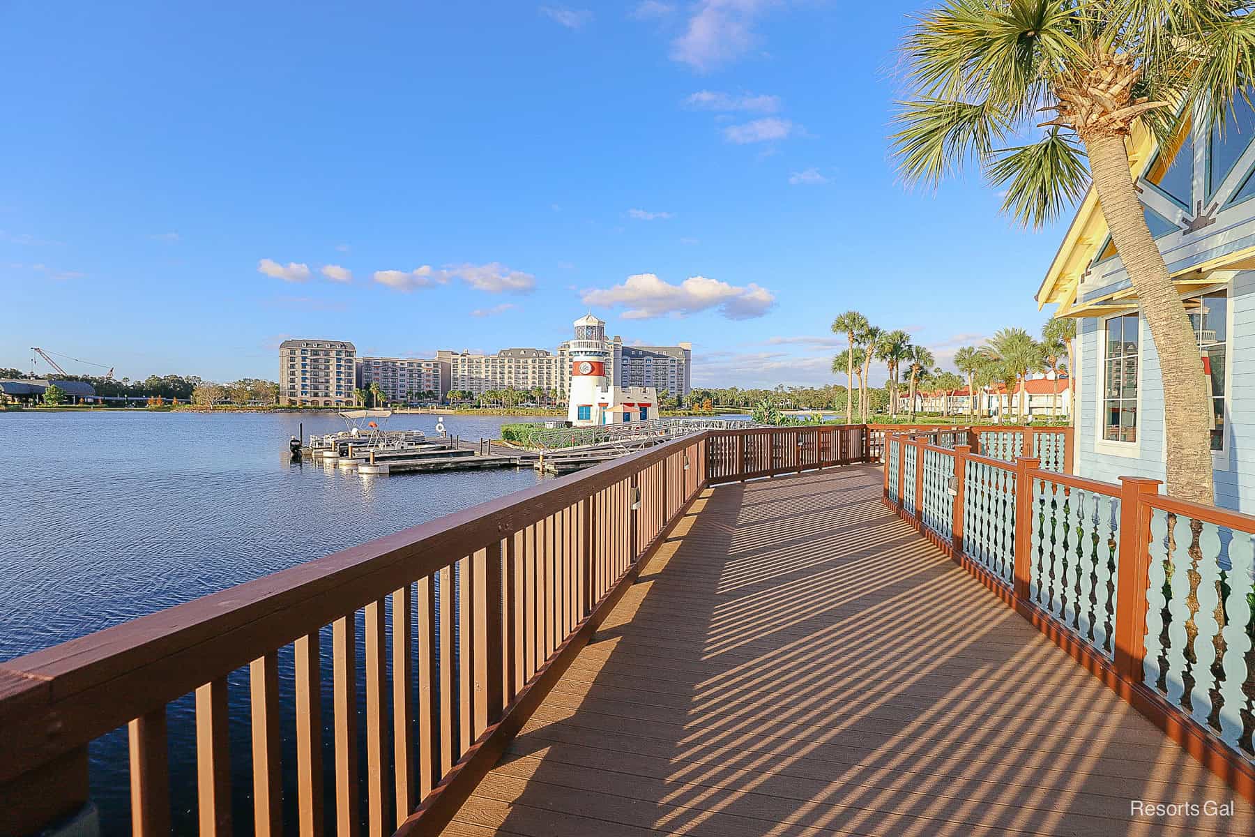 a view of the lighthouse and Riviera from the wooden walkway that wraps around Old Port Royale 