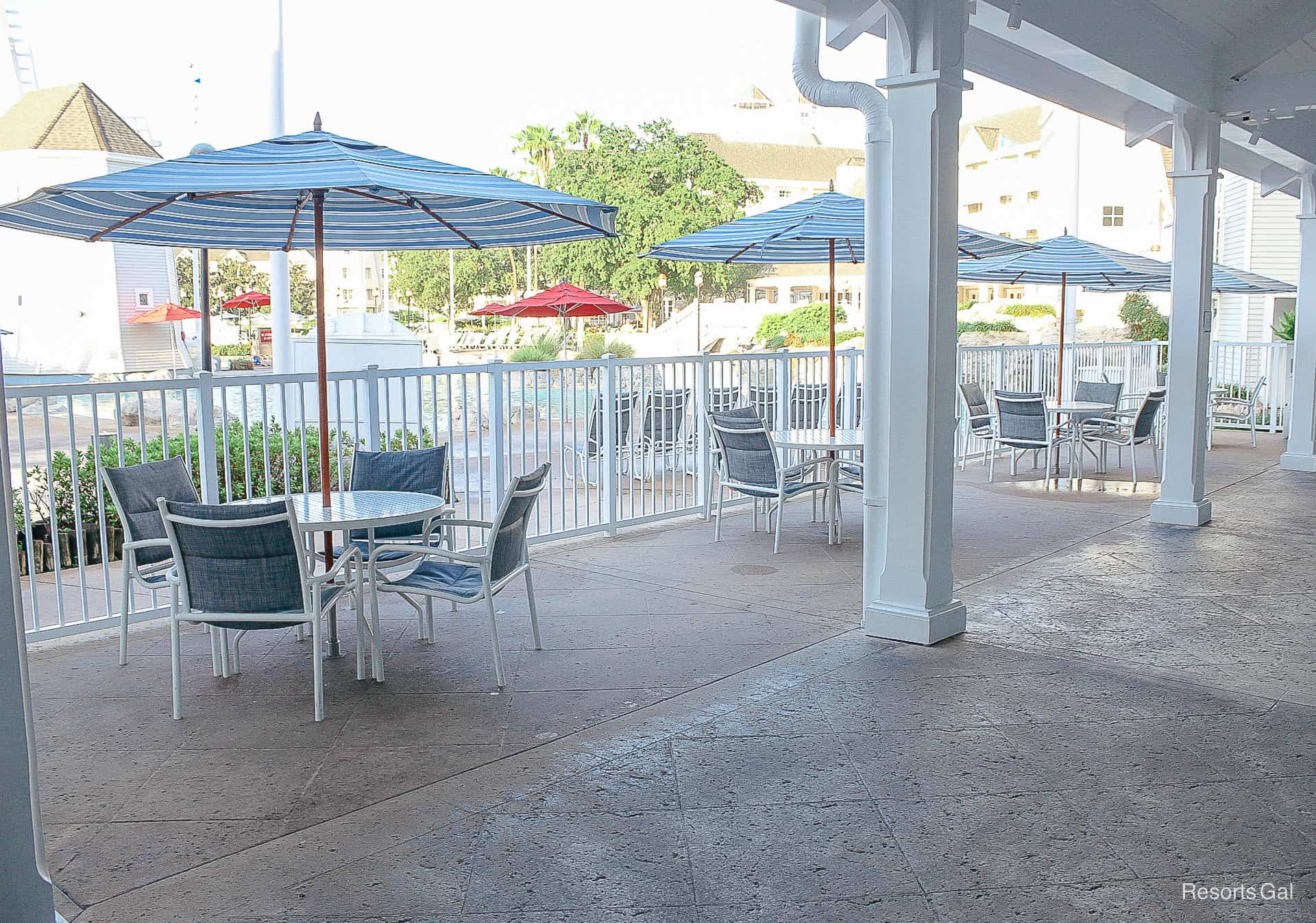 a covered, shaded area with an outdoor dining area 