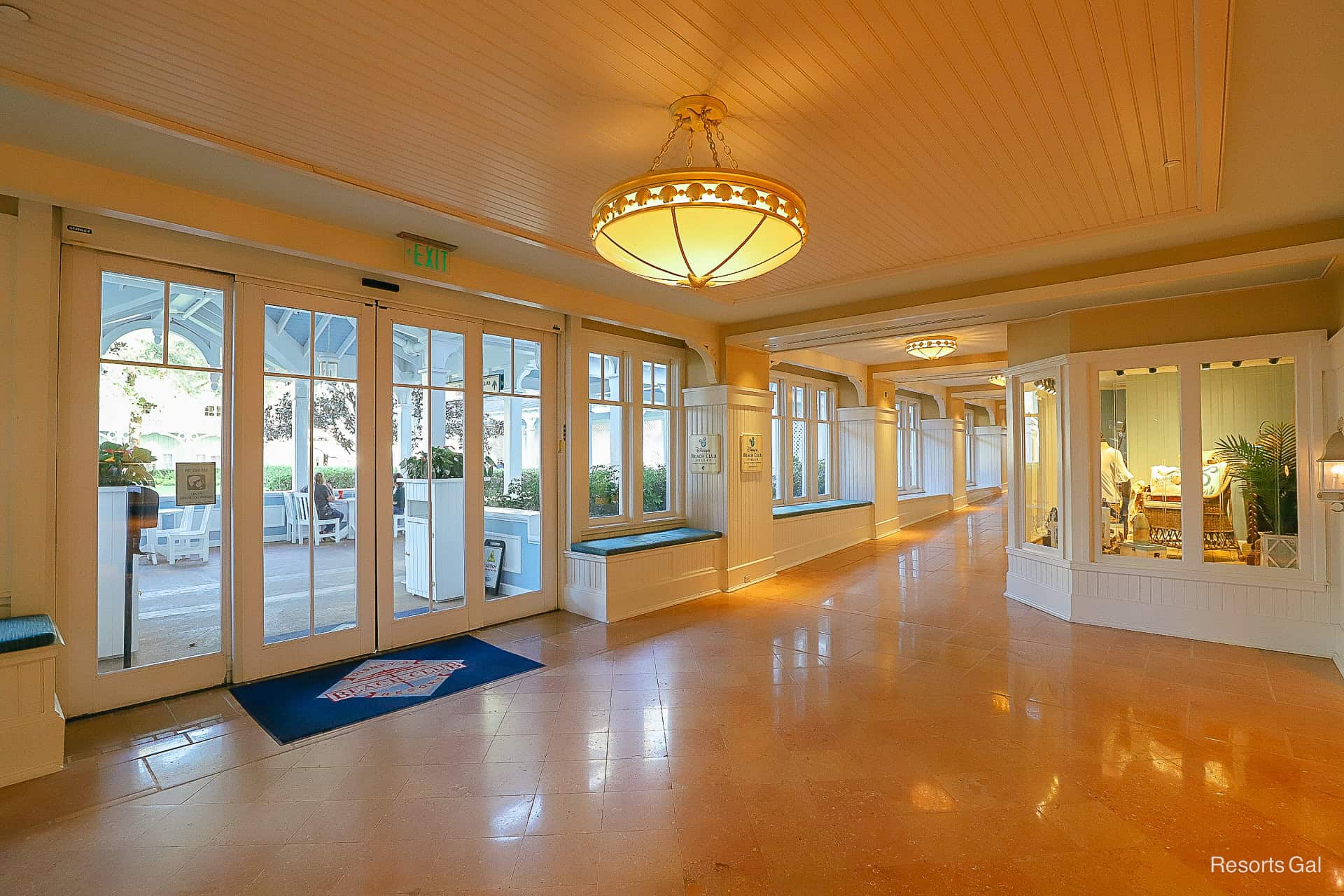 the indoor walkway between the Beach Club's quick service and doors leading to an outdoor dining area 