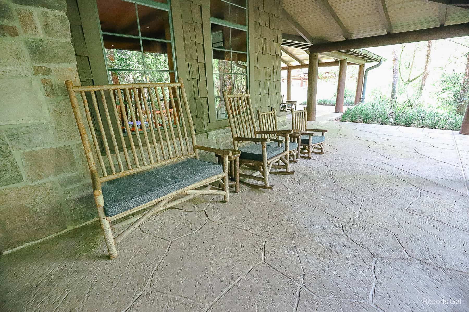 covered porches with wooden rockers make an outdoor seating area 