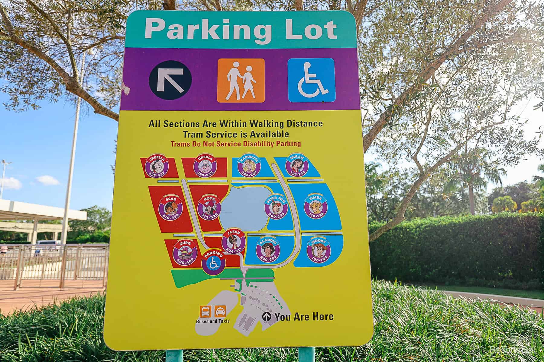 a parking lot sign for Magic Kingdom that breaks it down into heroes and villains