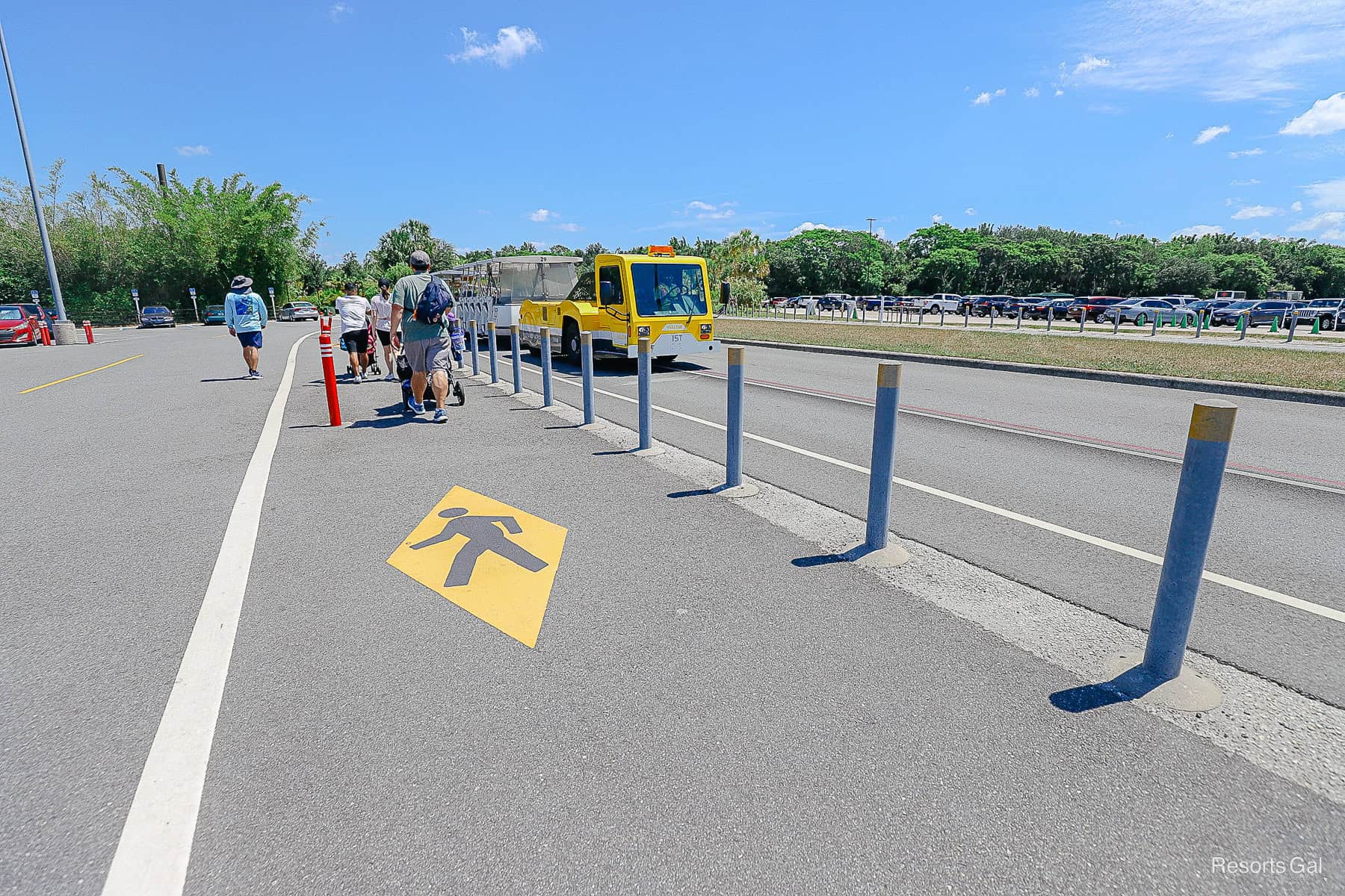 a walking symbol and path adjacent to the tram path 