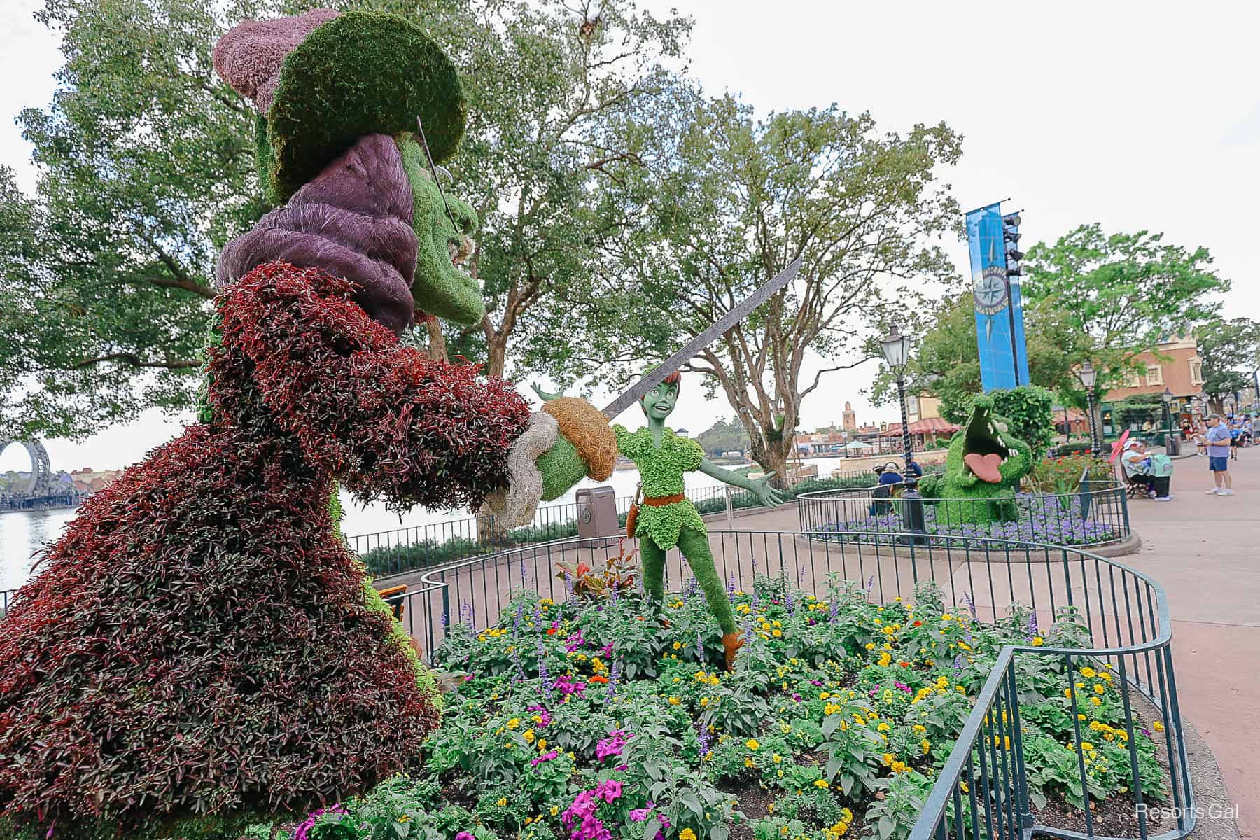 Tick Tock Crocodile added and shown in a nearby flower bed separate from the Peter Pan and Hook topiaries 