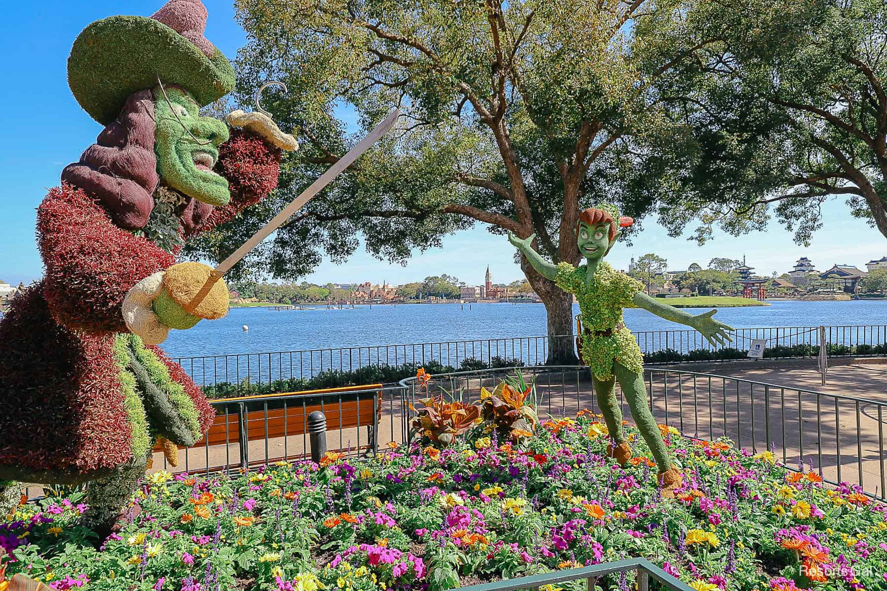 Captain Hook with sword extended and Peter Pan topiary forms in 2024. 