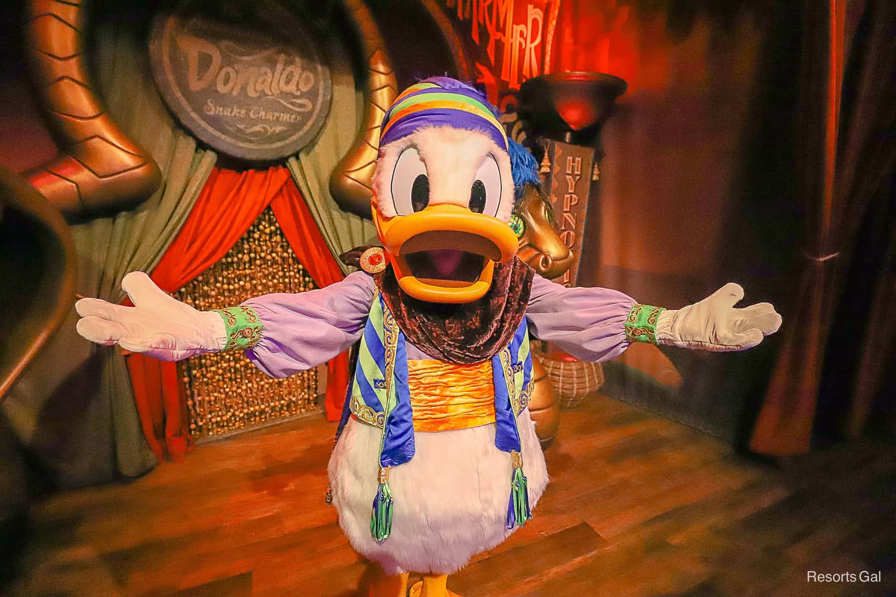 Donald with hands extended to greet guests. 