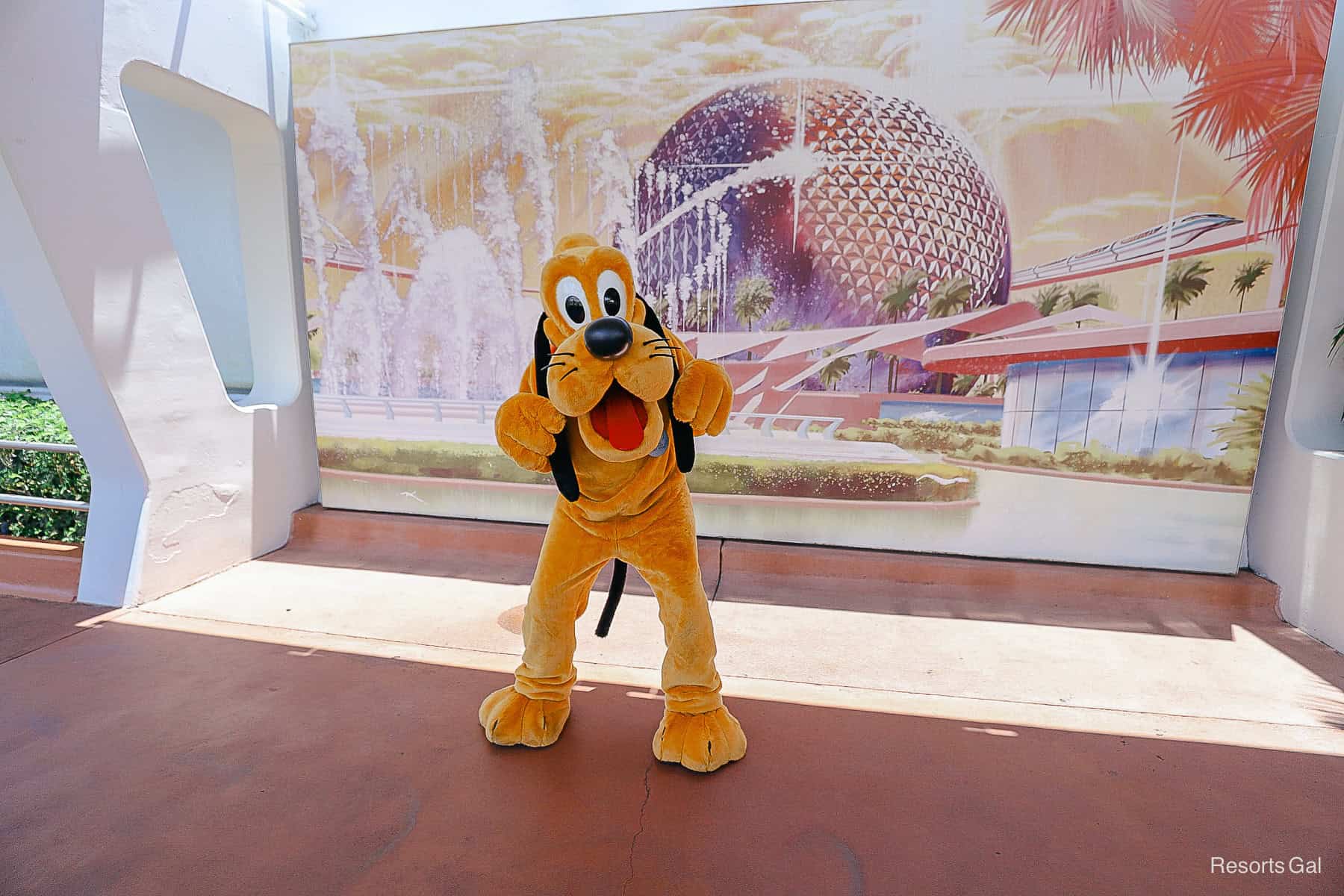 Pluto in front of the Spaceship Earth Mural 