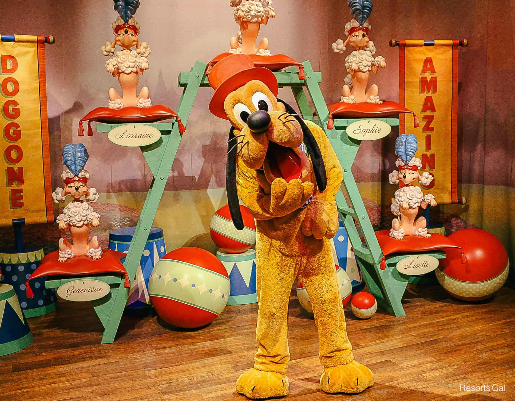 Pluto is wearing a red top hat. 