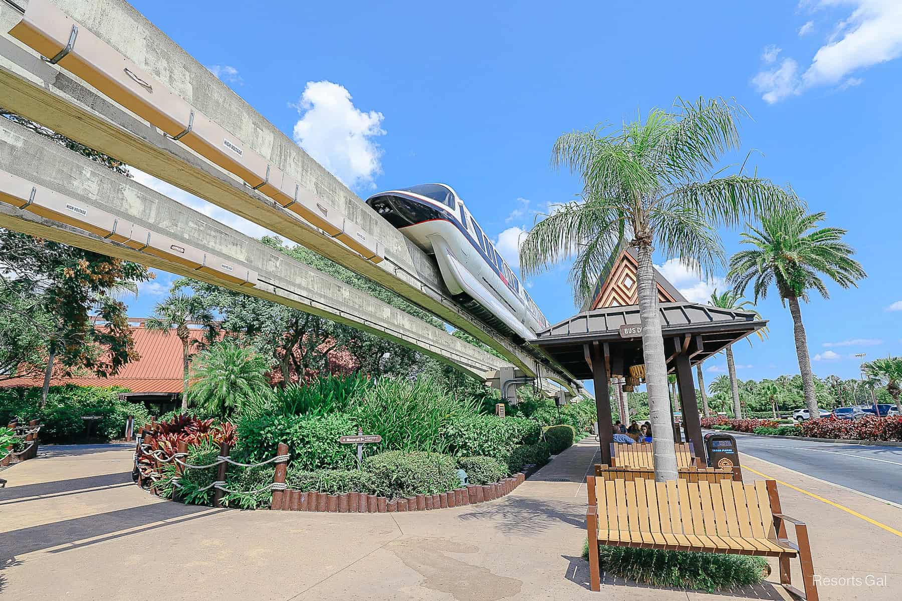 the monorail running above the bus stop at the Polynesian 