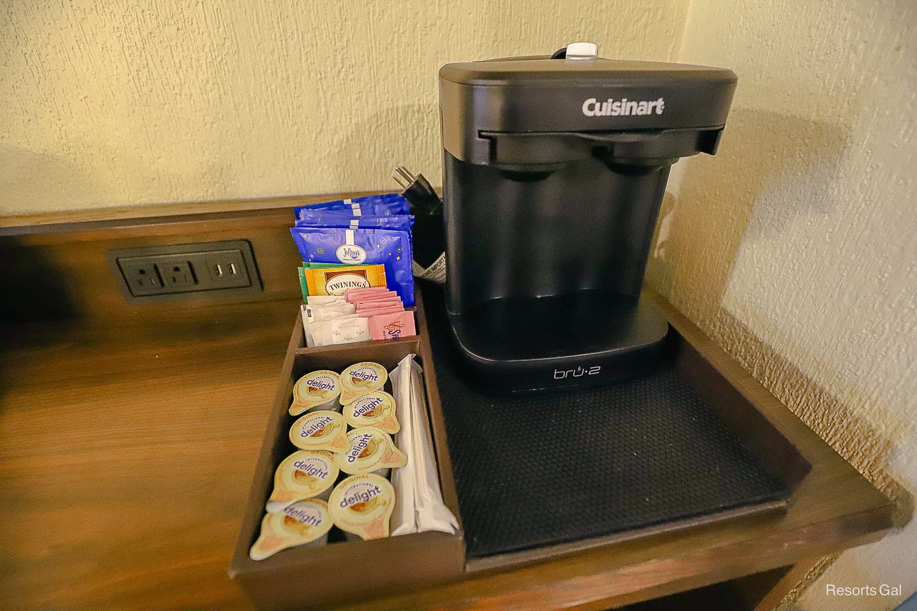 the two-cup, in-room coffee maker at Port Orleans Riverside Resort with creamer and sweeteners