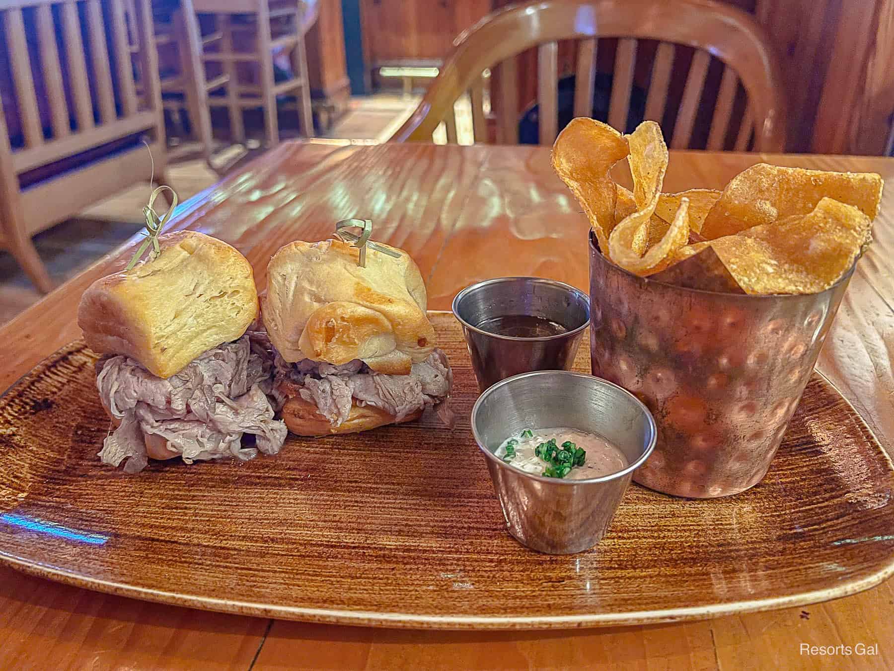 the plate with prime rib sliders and Disney housemade potato chips 