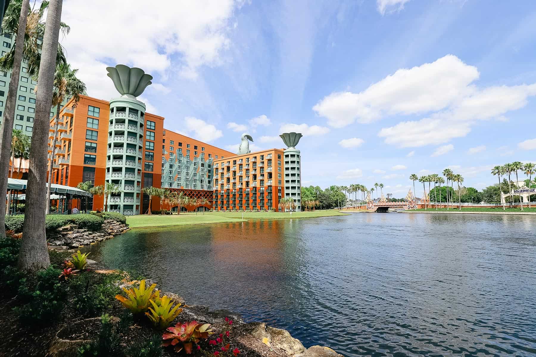 shows a hotel with Epcot in the distance to demonstrate an upgrade to a deluxe resort amenity 