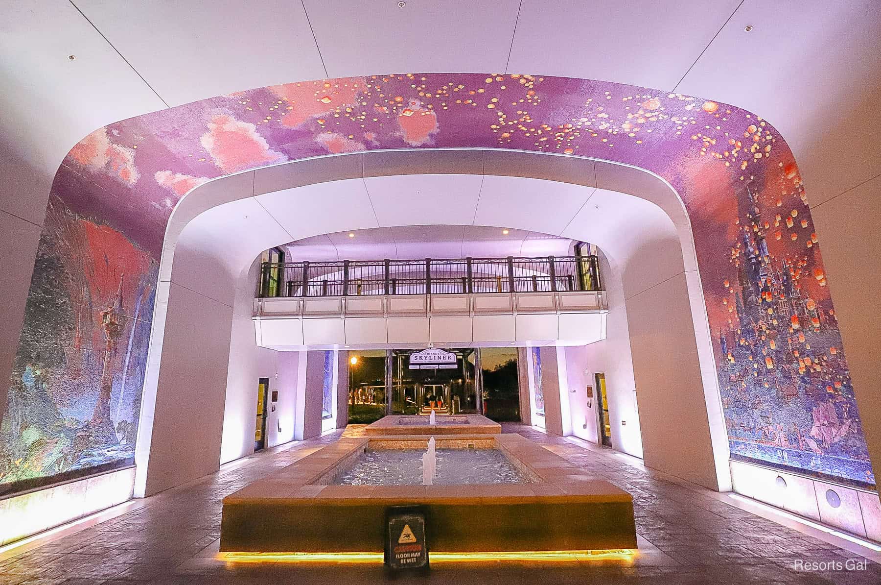 the fountain tunnel with murals at nighttime 