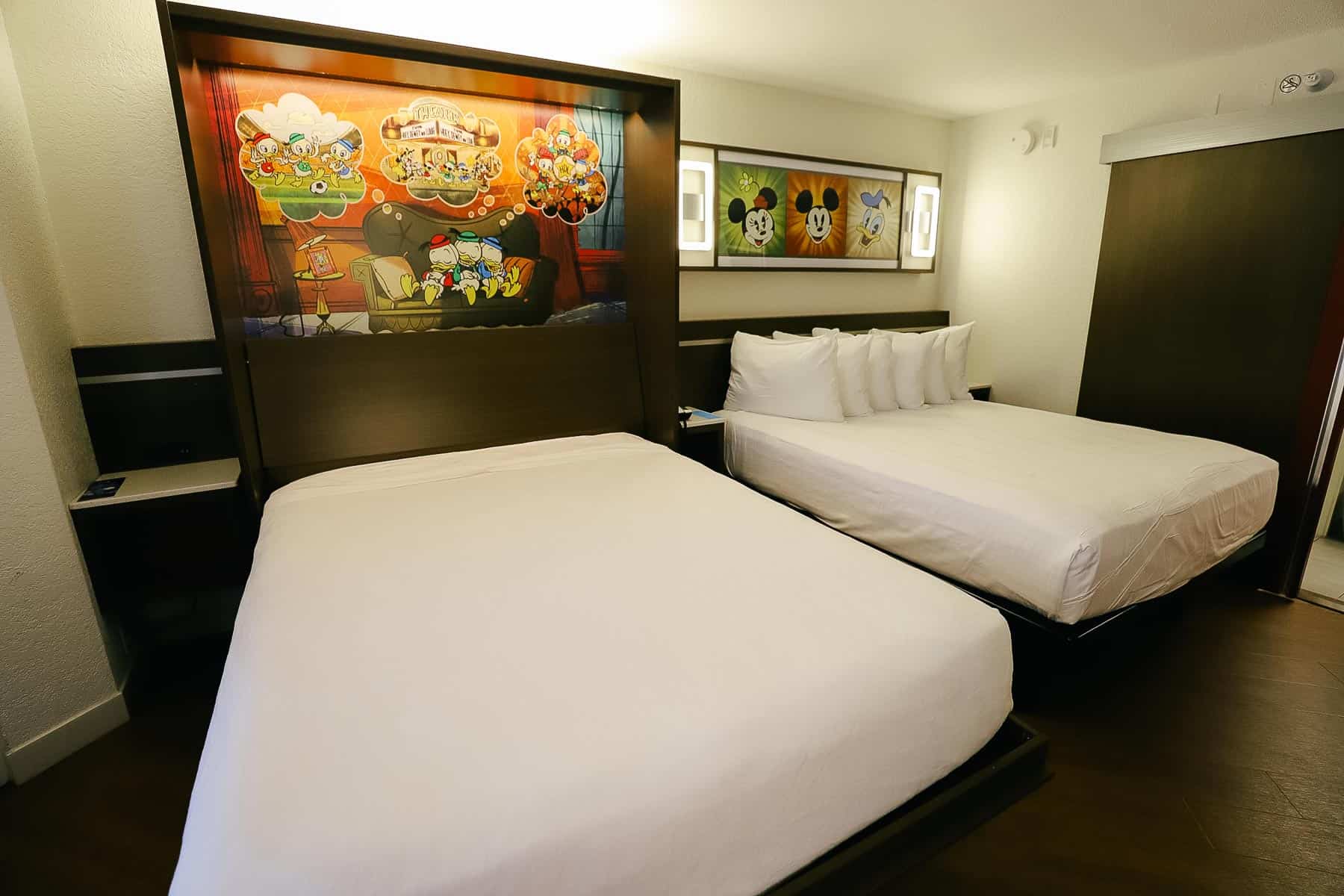 two queen size beds in a standard room at Disney's All-Star Music Resort 