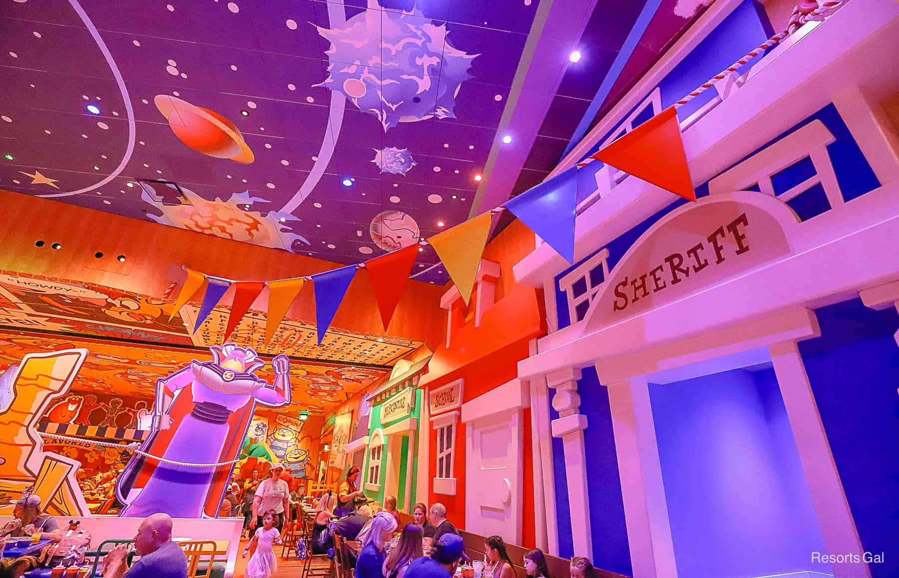 Zurg with flags hanging across the room 