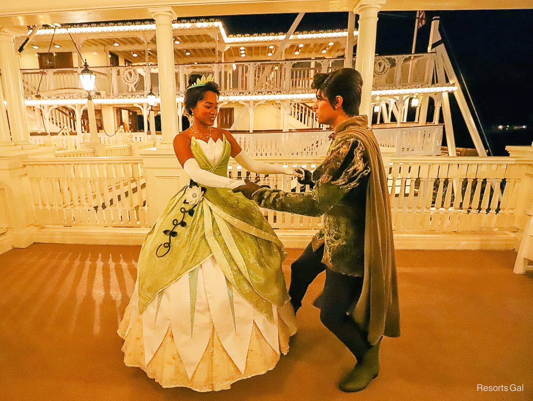 Prince Naveen spins Tiana by the Liberty Square Riverboat. 