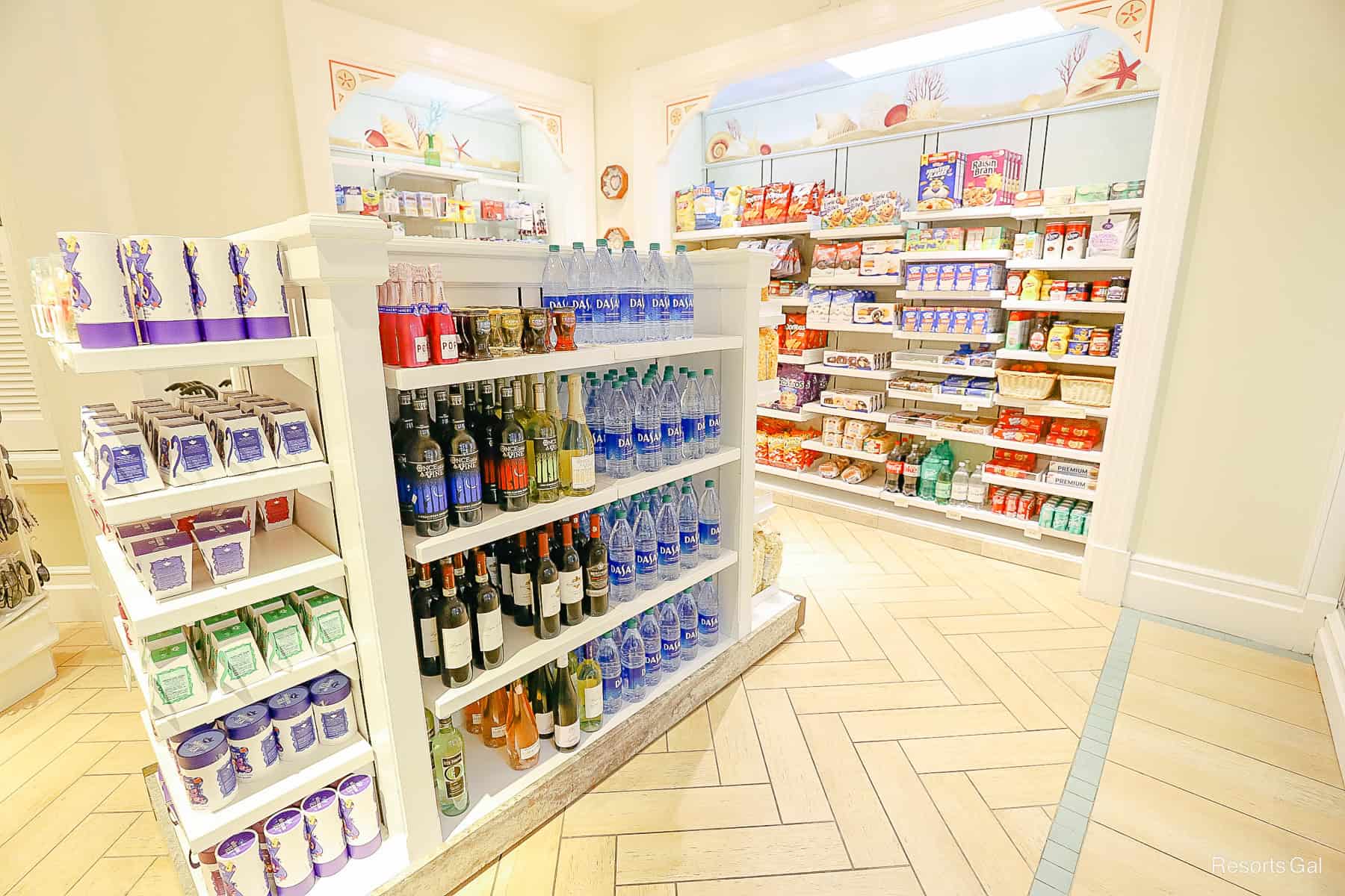 a display with wine, bottled water, and various other beverages 