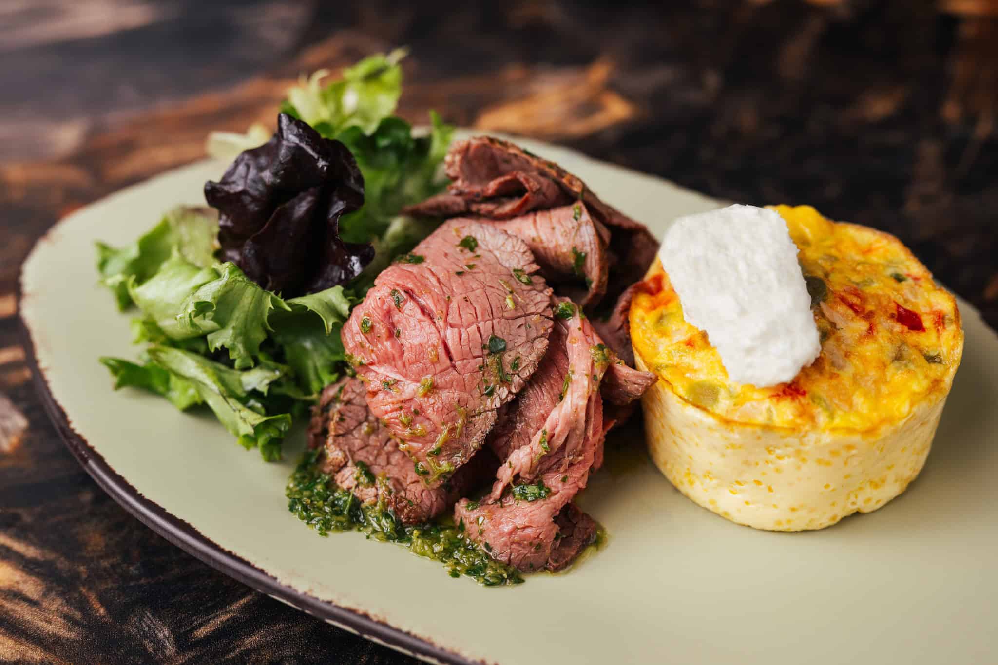 Breakfast Menu Item Satu'li Canteen: Vegetable-Goat Cheese Frittata with wood-fired beef tossed in chimichurri