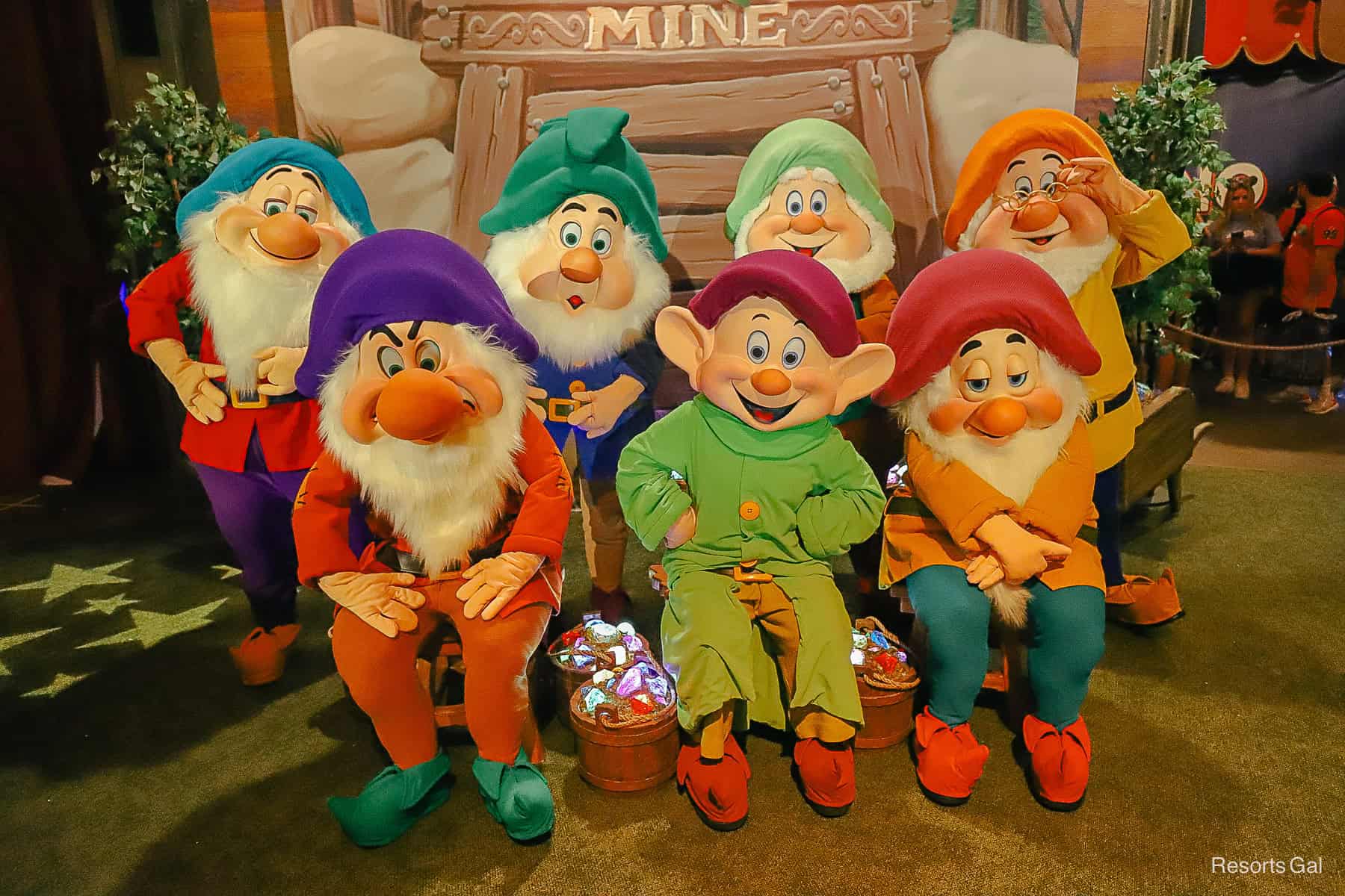 The Seven Dwarfs pose for a photo with guests.