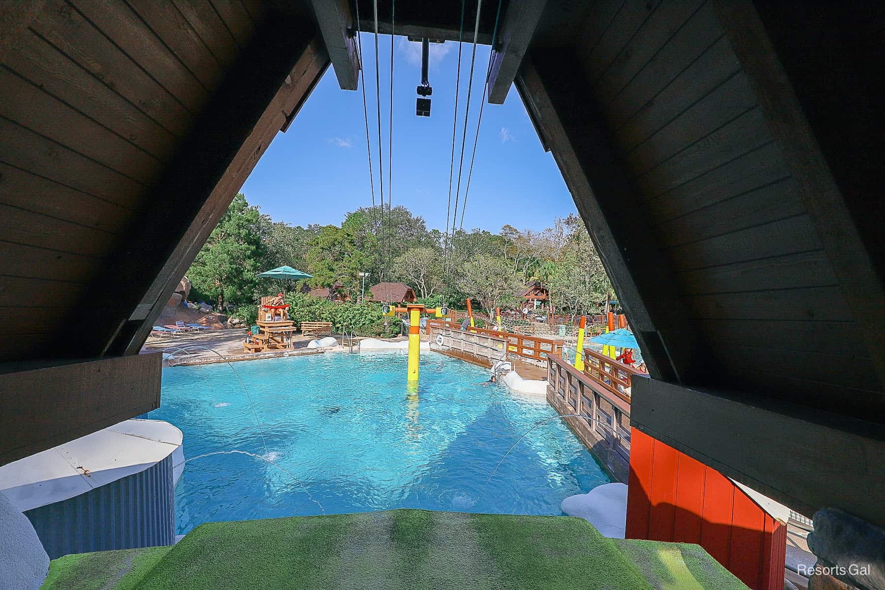 the zip line as it extends into the pool area 