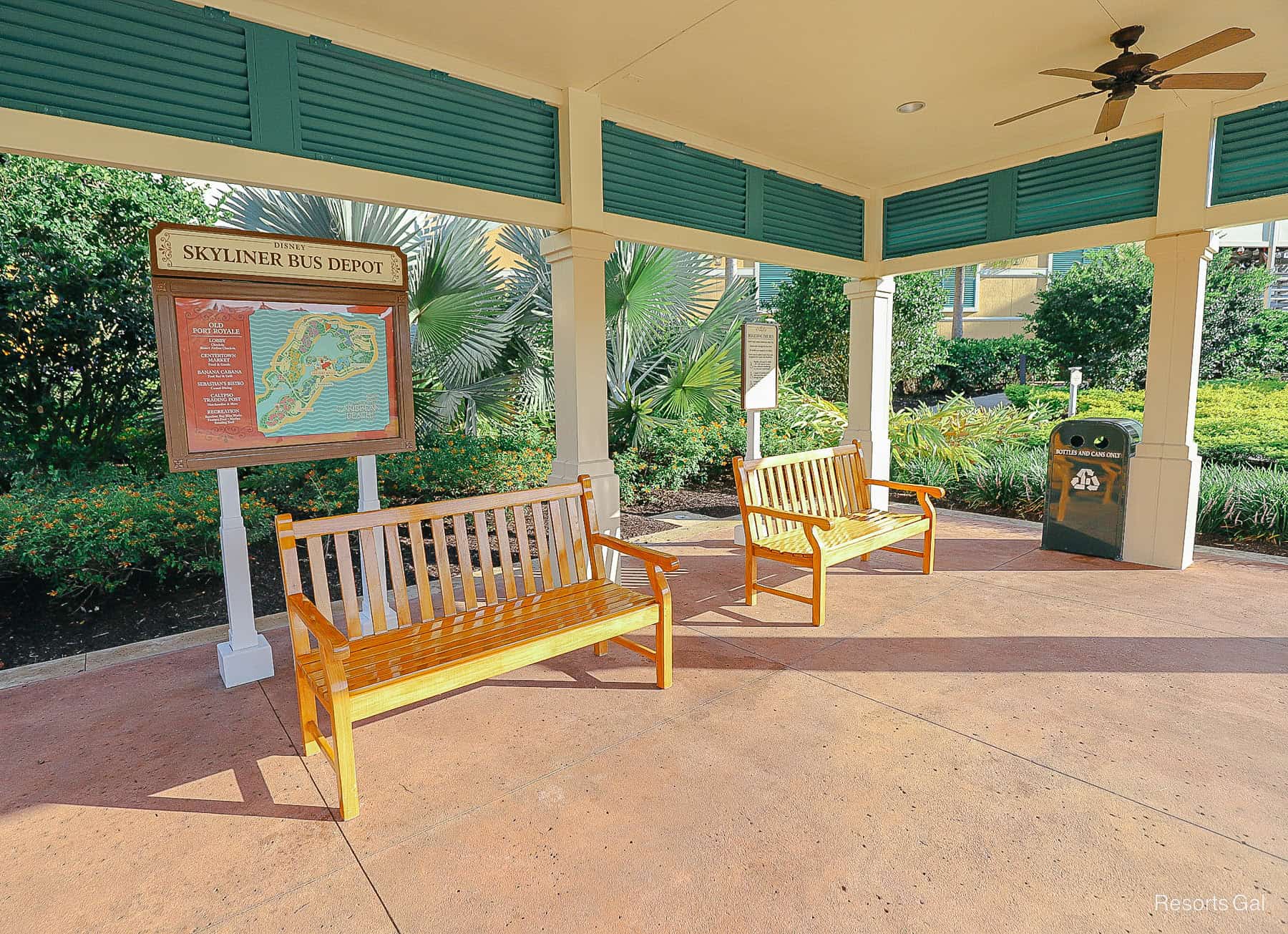 two benches in the afternoon sun at the Skyliner Bus Depot at Disney's Caribbean Beach 