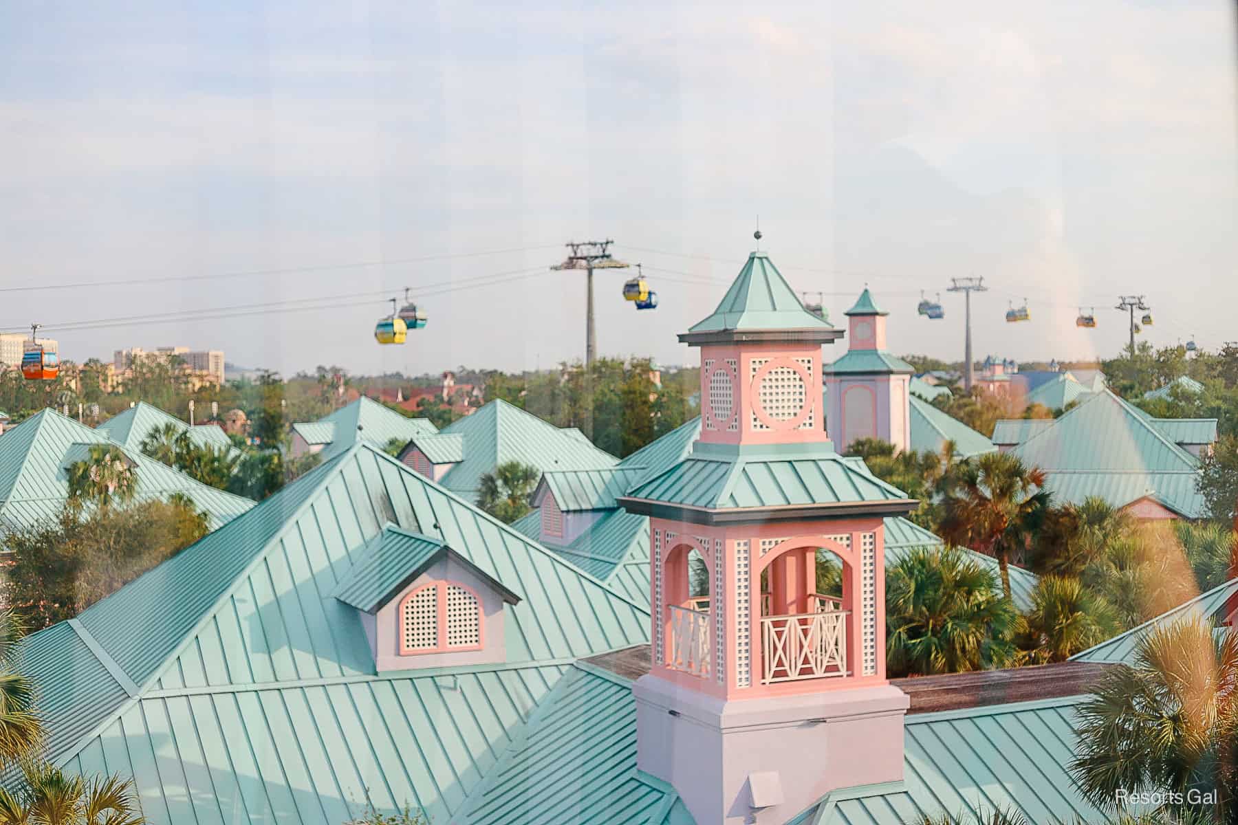 the Skyliner as it travels over Caribbean Beach with a view of the other Skyliner cars in the distance 