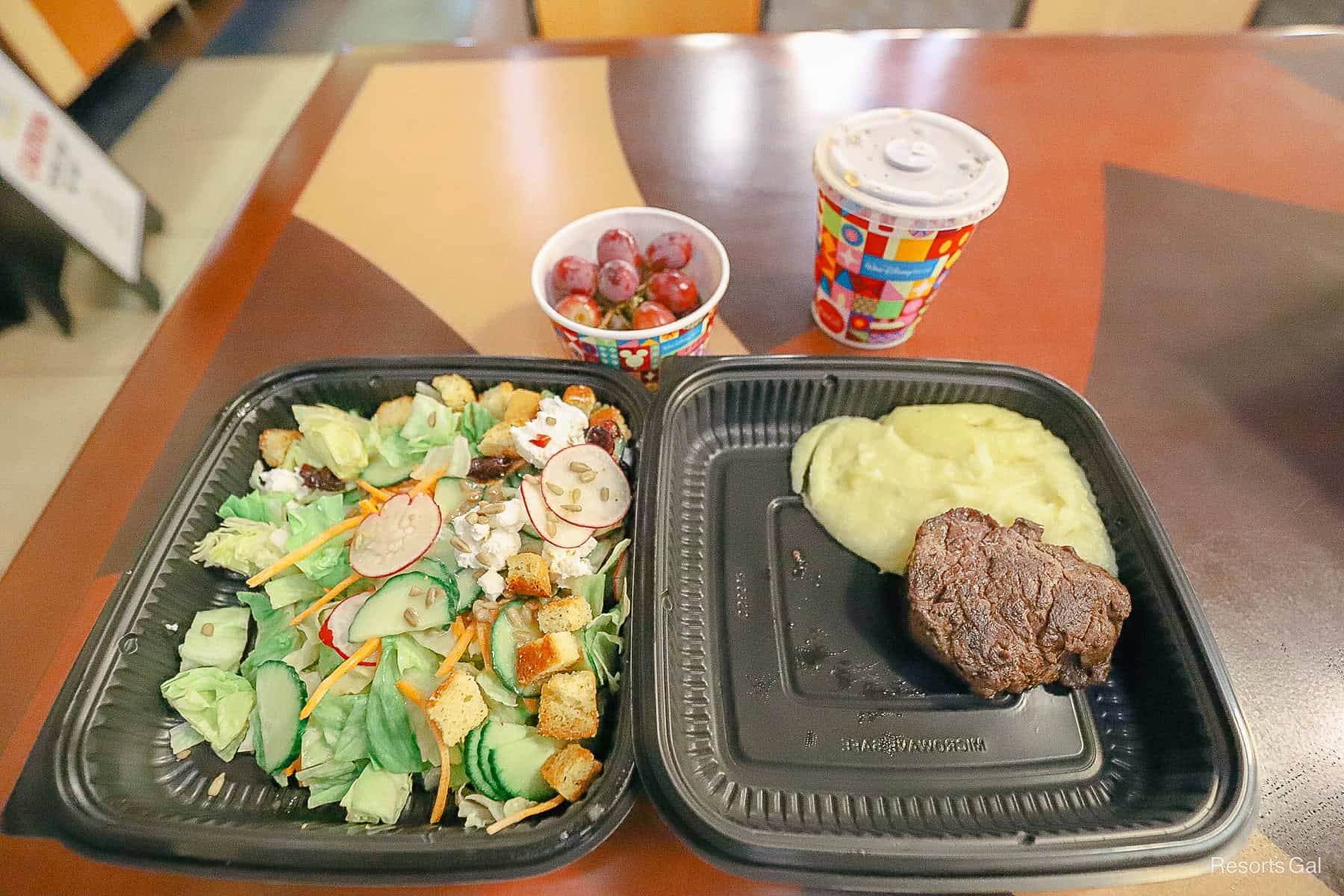 a kids' meal with a side salad from Steakhouse 71 mobile orders