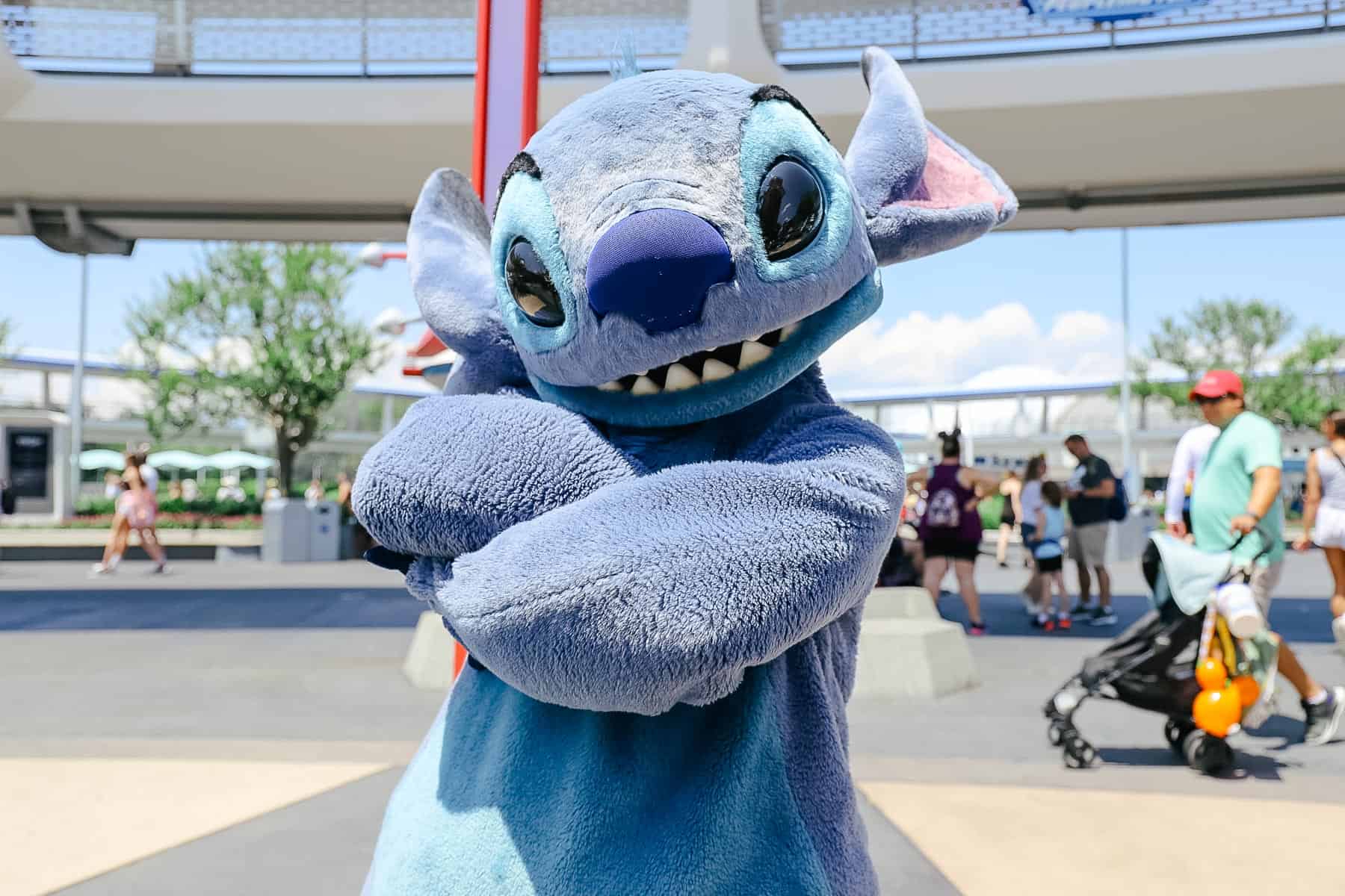 Stitch stops to pose in Tomorrowland. 