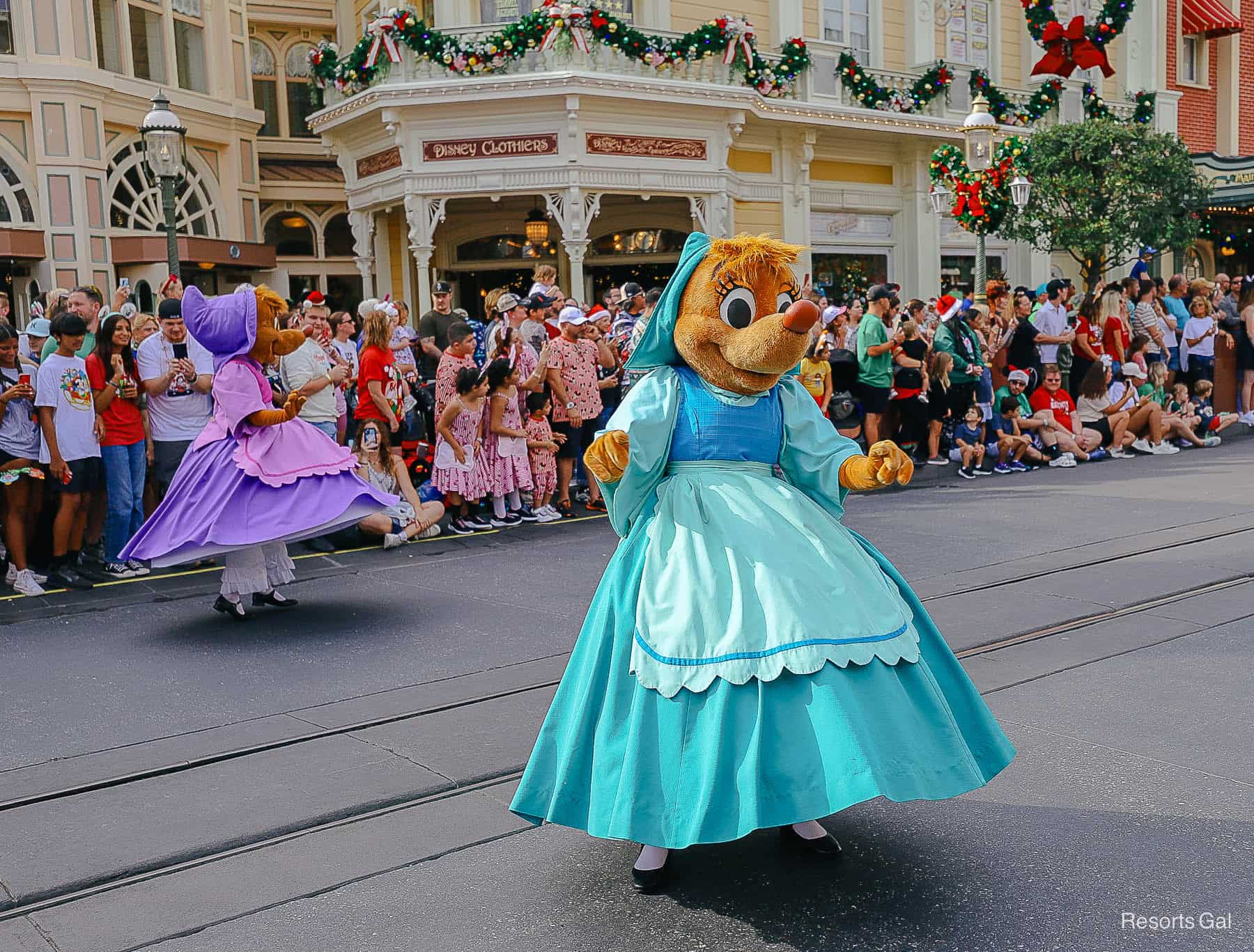 Suzy and Perla twirl their dresses in the Christmas Parade 