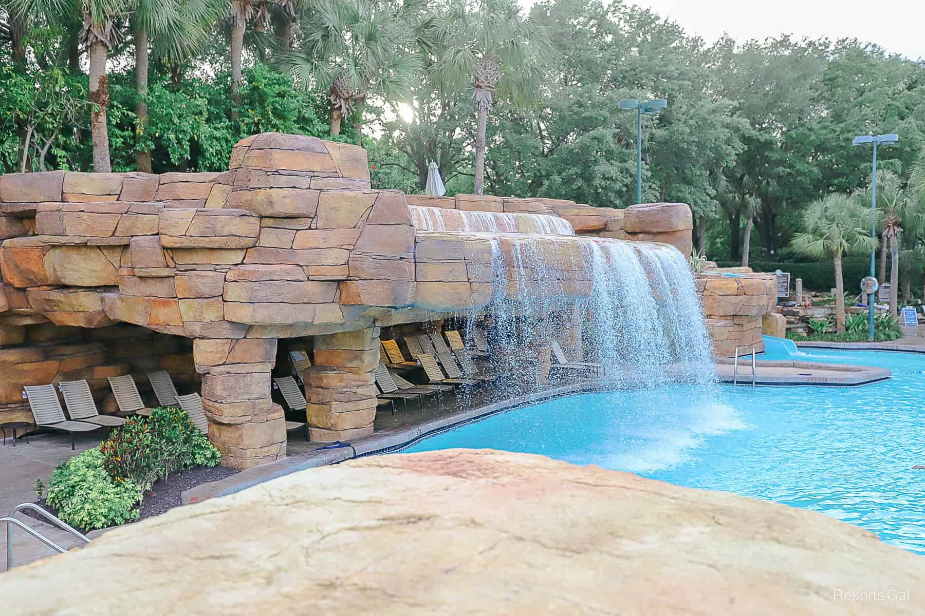 the waterfall and the shaded grotto seating area for guests 